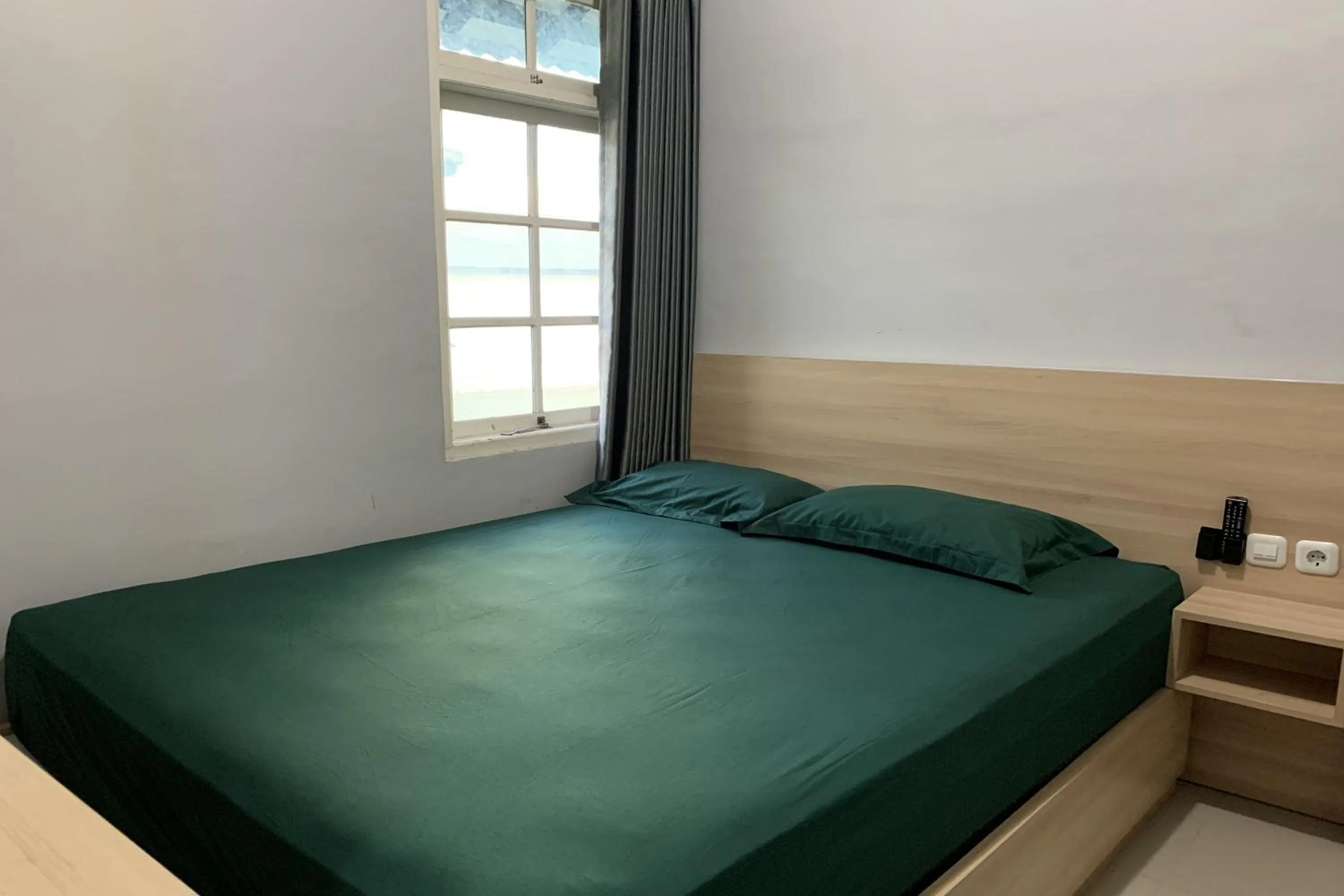 Bed in Hotel Merak Indah