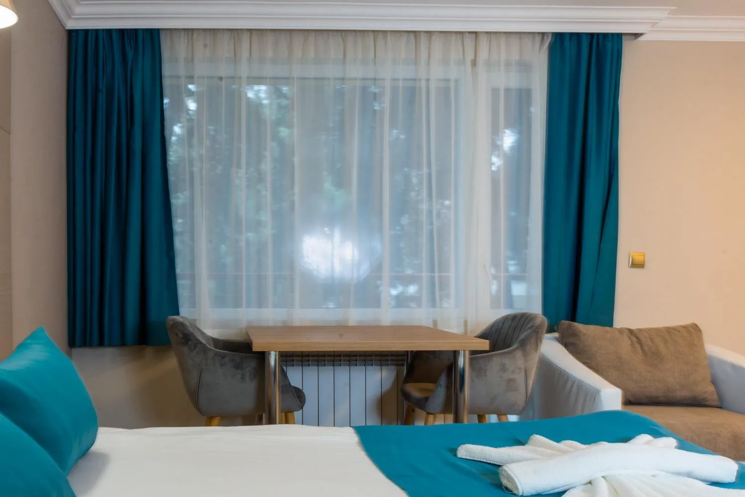 Living room, Bed in Vemara City Boutique Hotel-free parking