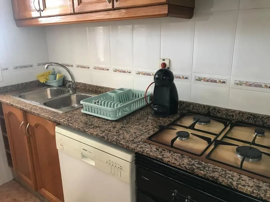 Kitchen or kitchenette in Apartamento cómodo y espacioso con parking