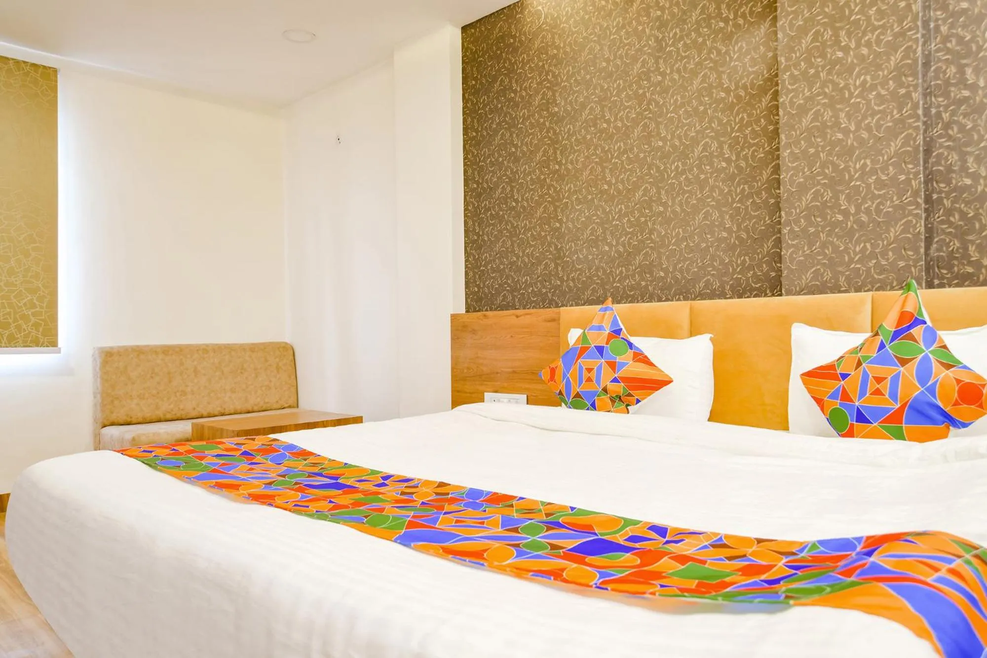 Bed in FabHotel Woodlark Inn