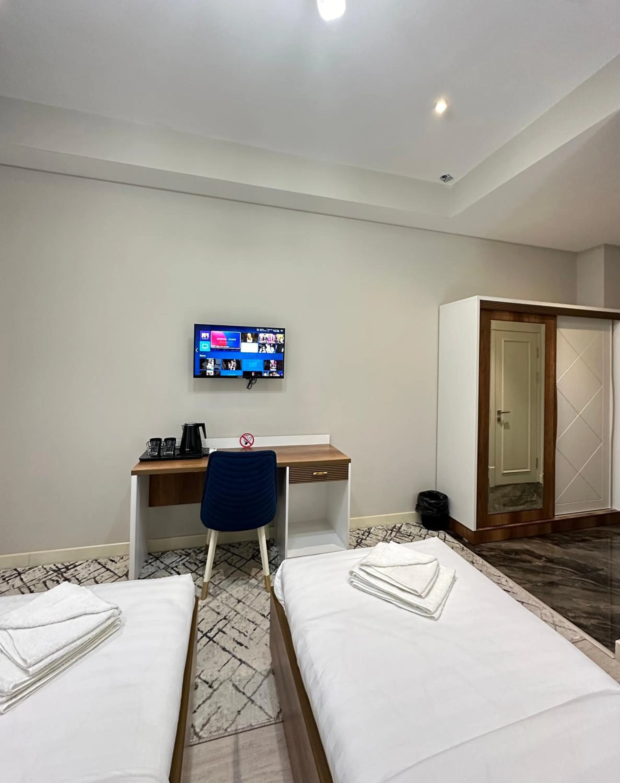 Communal lounge/ TV room, Bed in Nur Makon Hotel