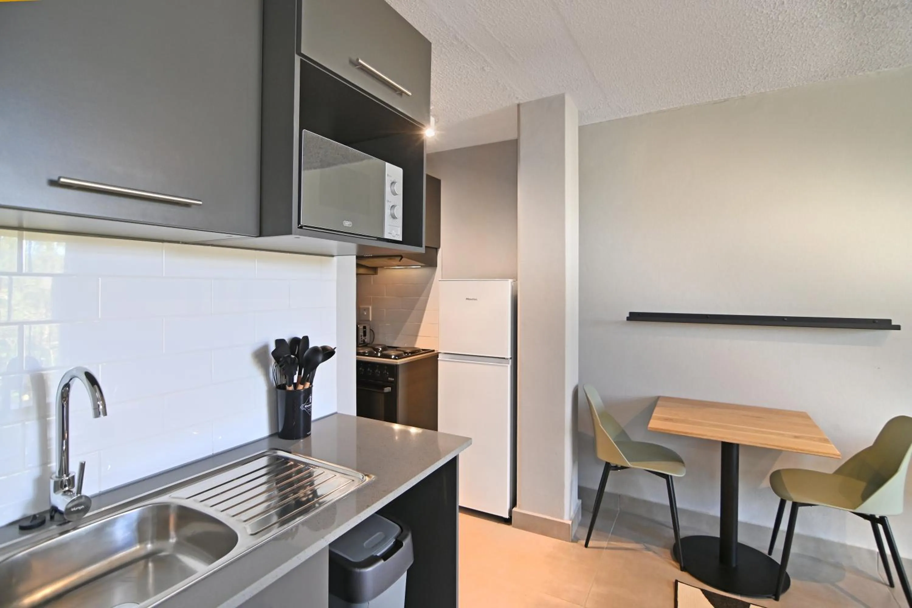 Kitchen or kitchenette in Circa Aparthotel by Totalstay