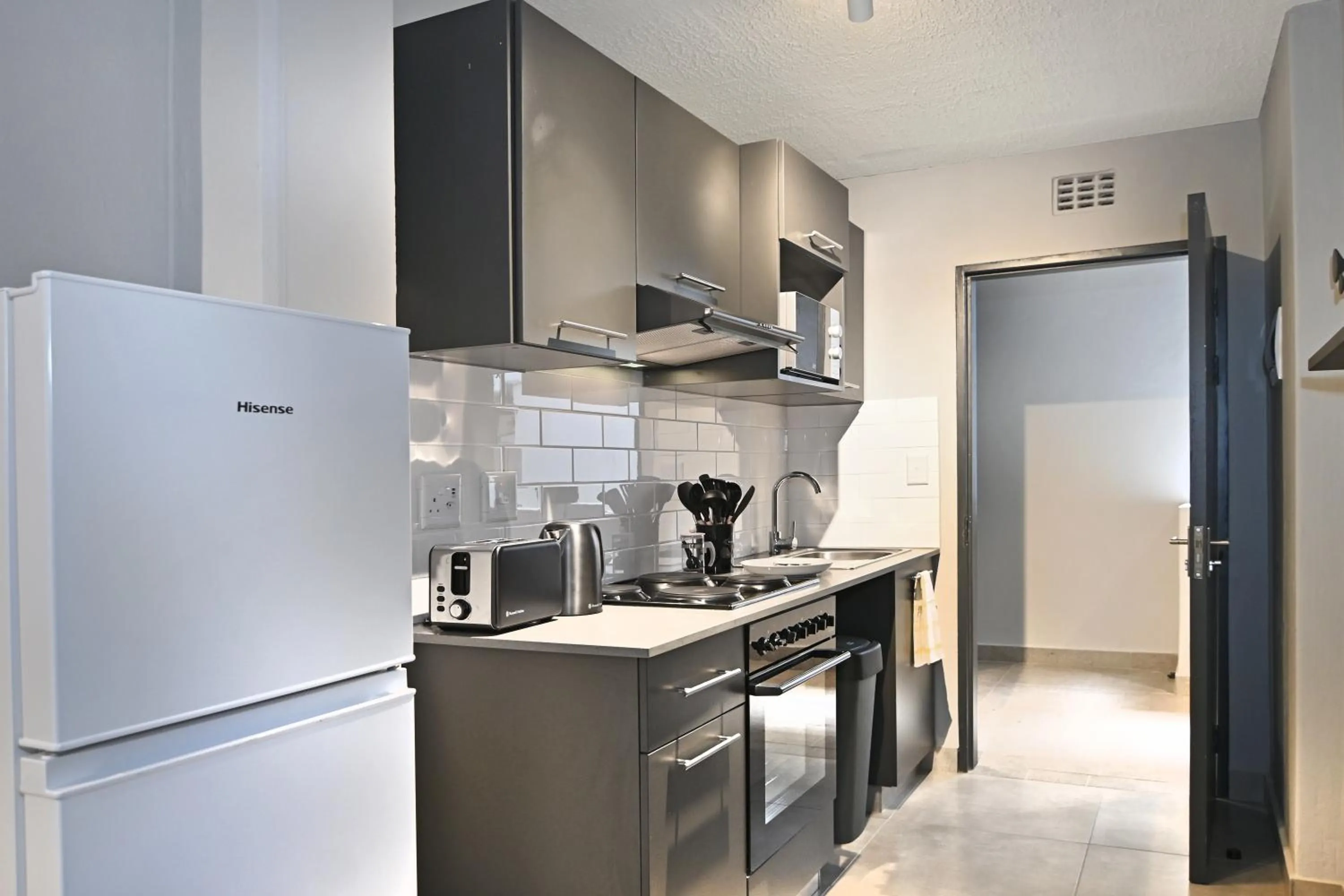 Kitchen or kitchenette in Circa Aparthotel by Totalstay