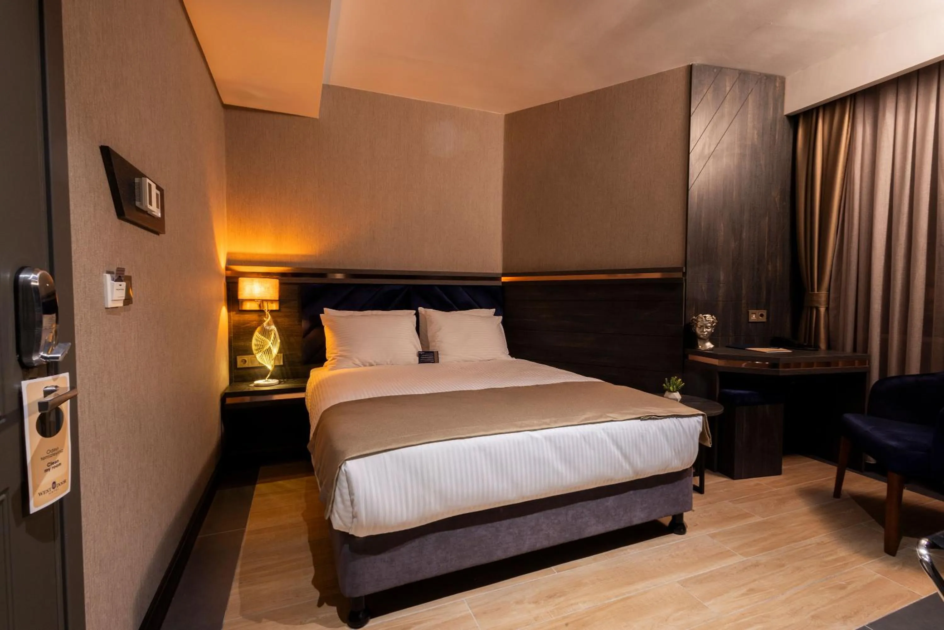 Bed in WestDoor Hotel