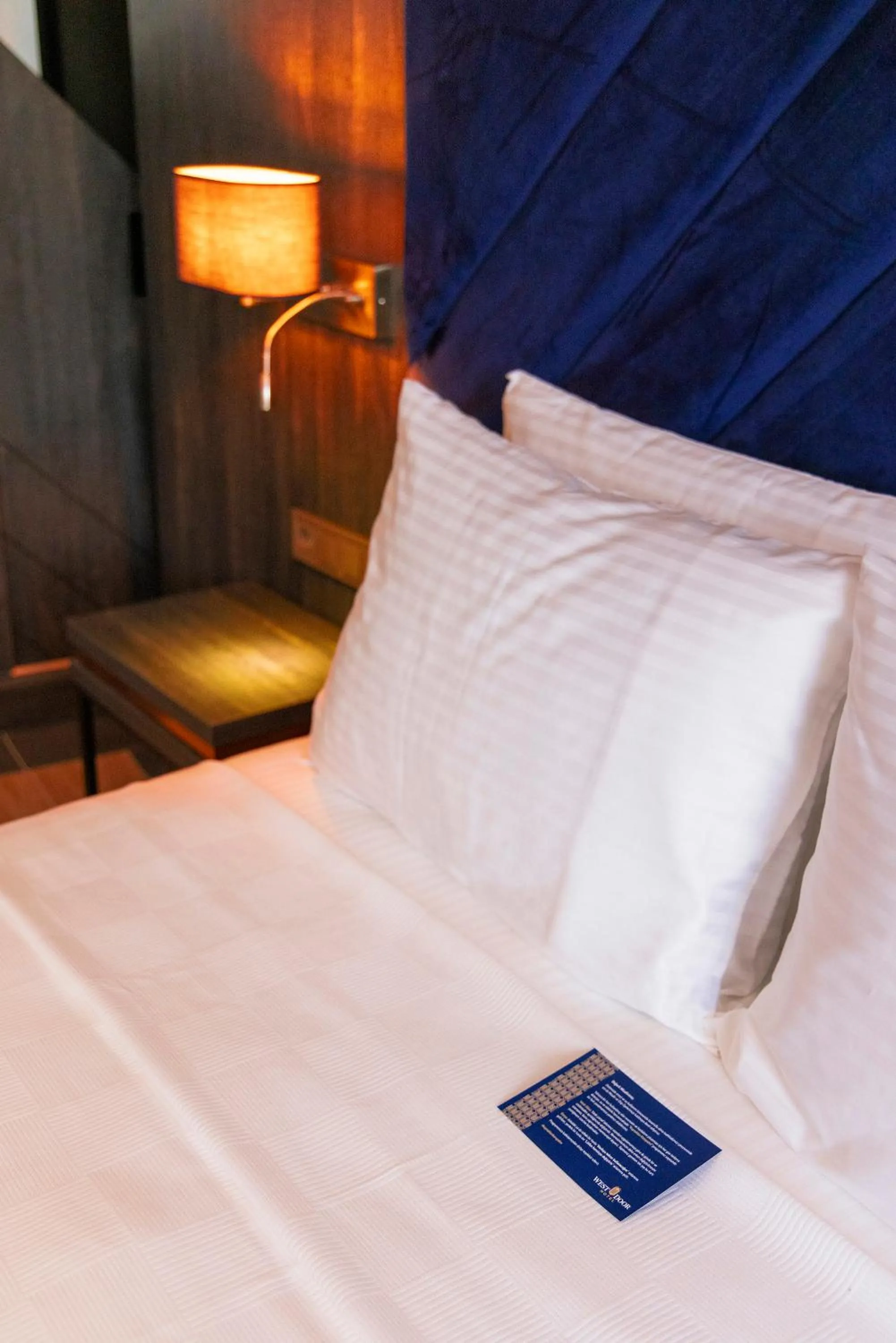 Bed in WestDoor Hotel