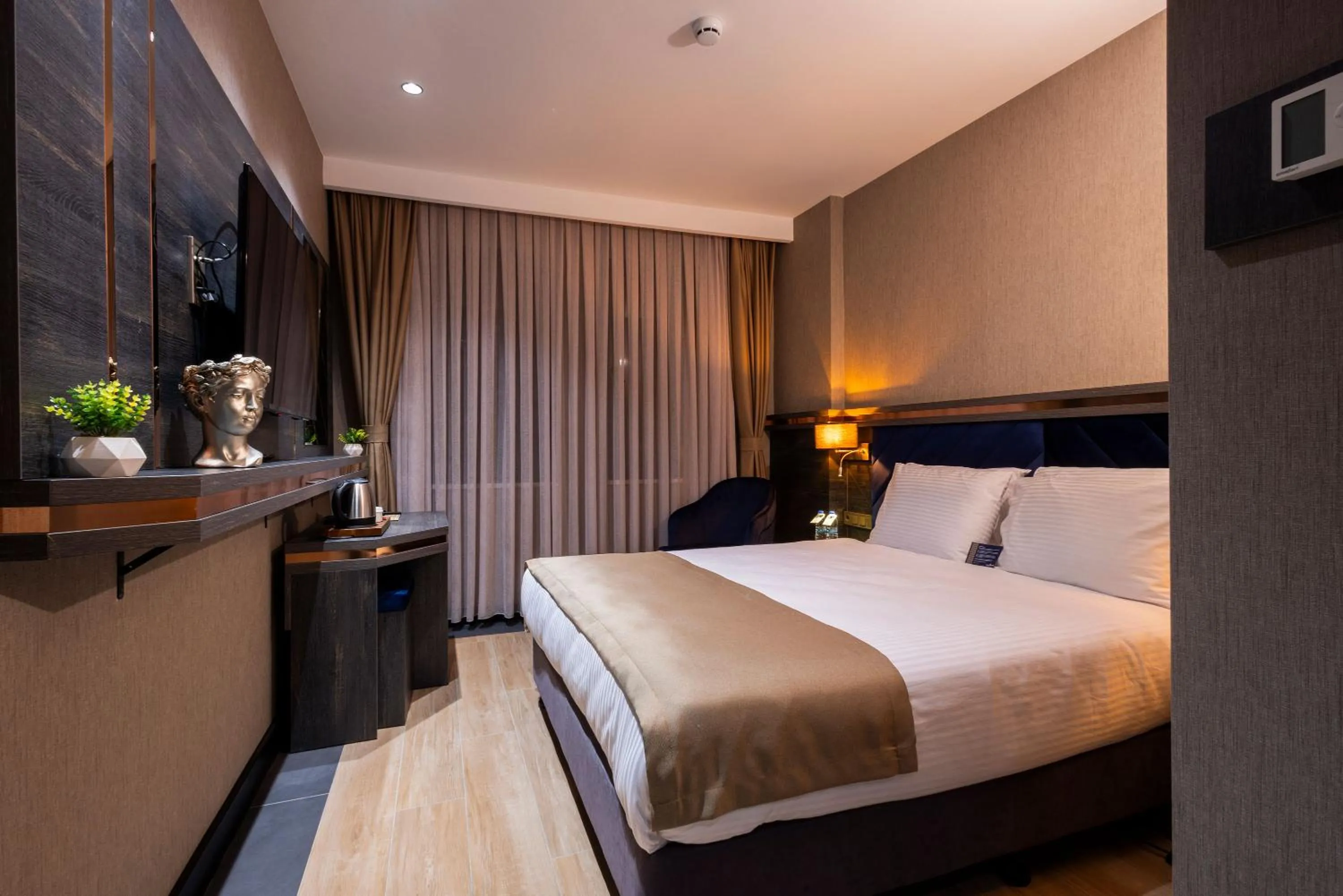 Bed in WestDoor Hotel