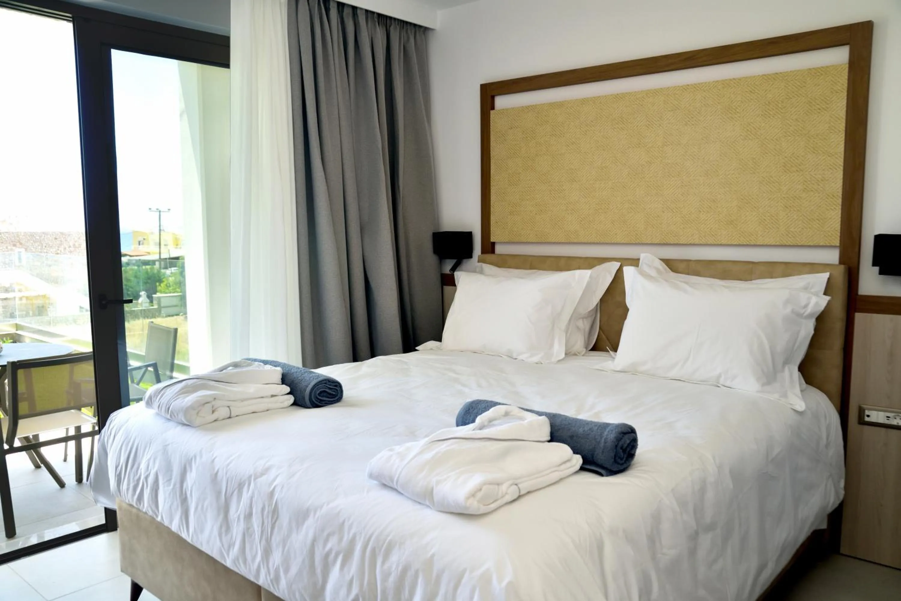 Photo of the whole room, Bed in KOUROS STONE SUITES