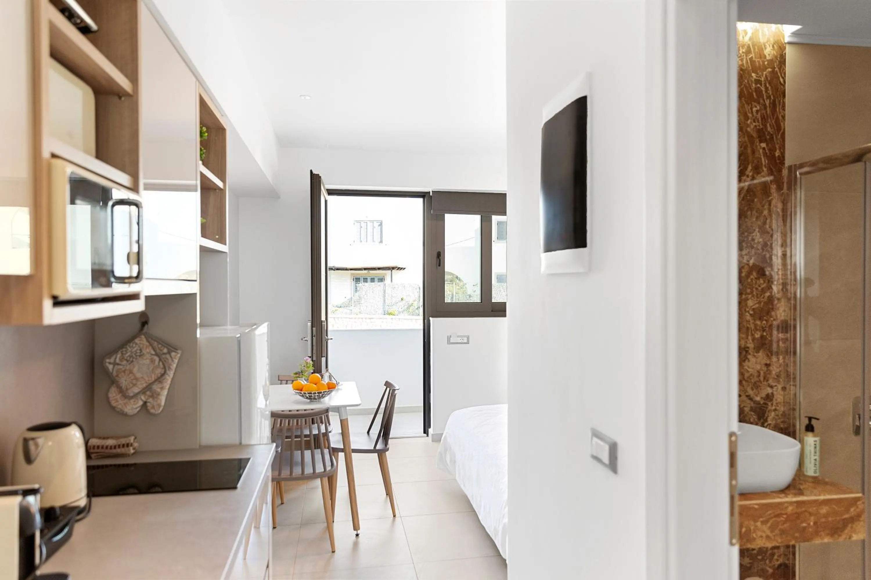 Property building in KOUROS STONE SUITES