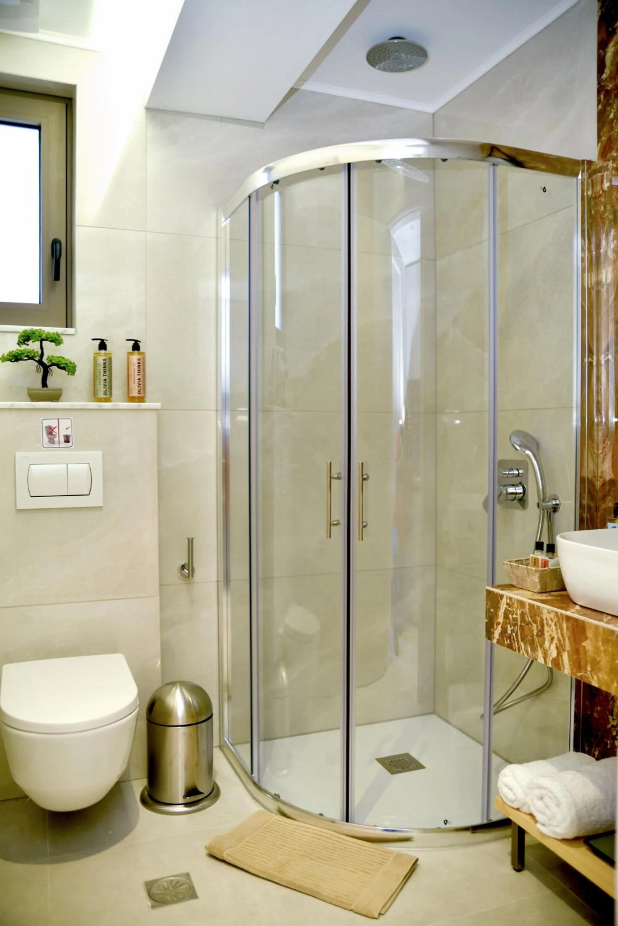 Shower in KOUROS STONE SUITES