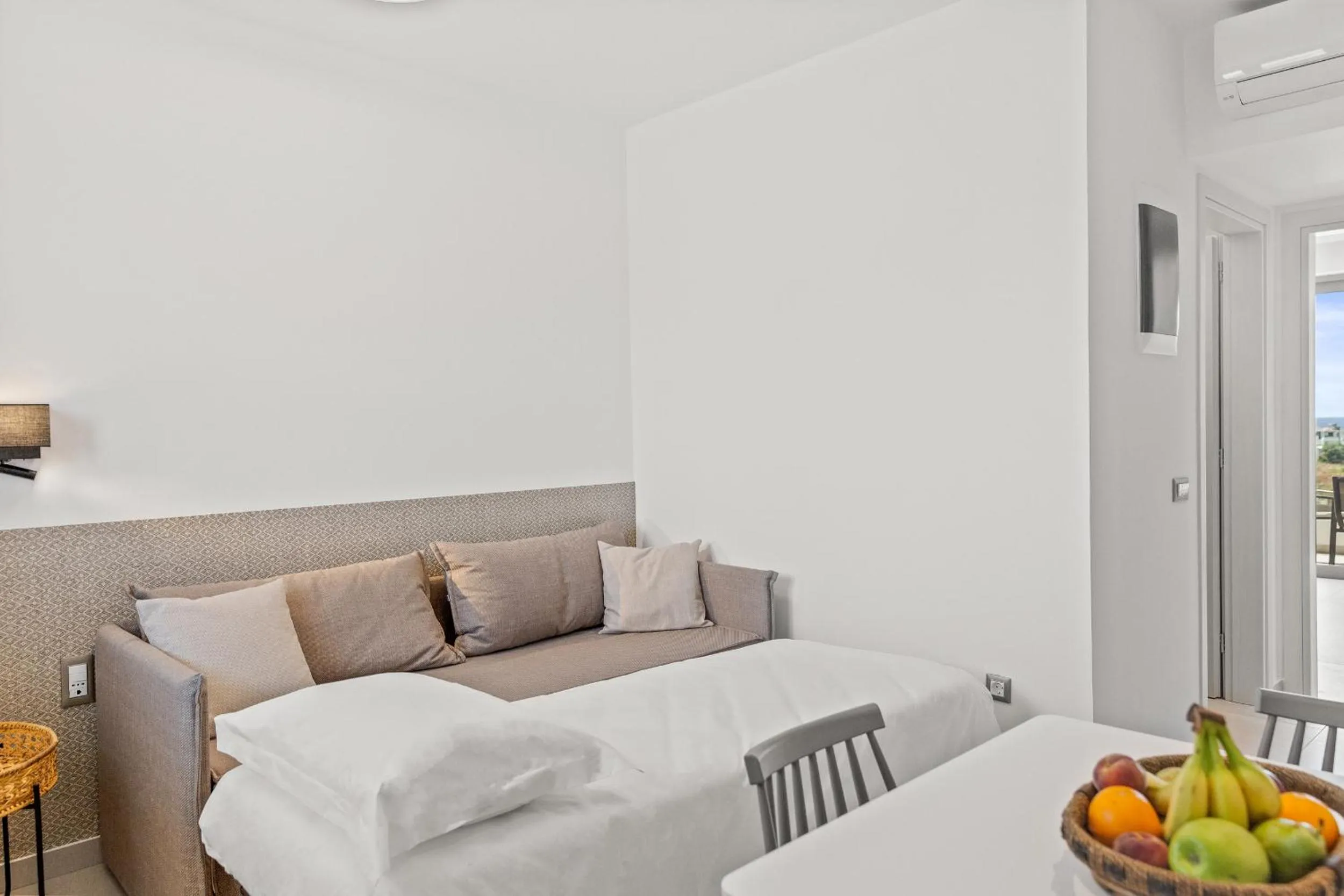 Living room, Bed in KOUROS STONE SUITES