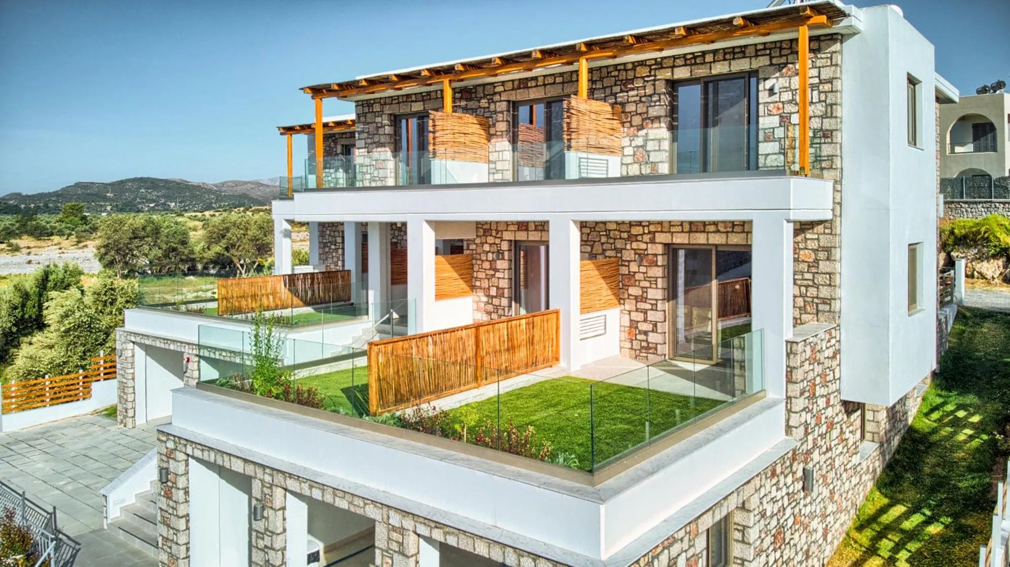 Property building in KOUROS STONE SUITES