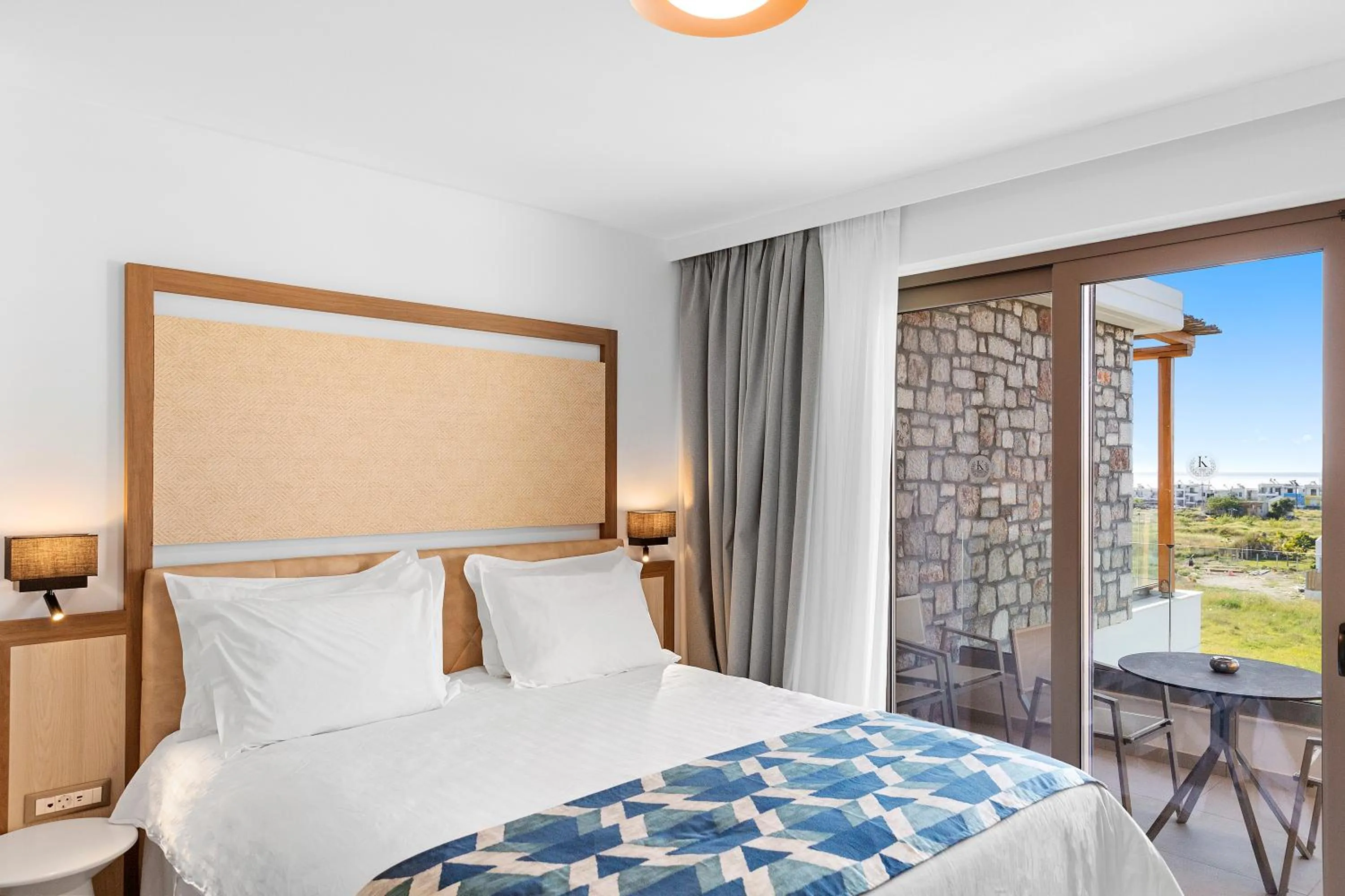 Bed in KOUROS STONE SUITES