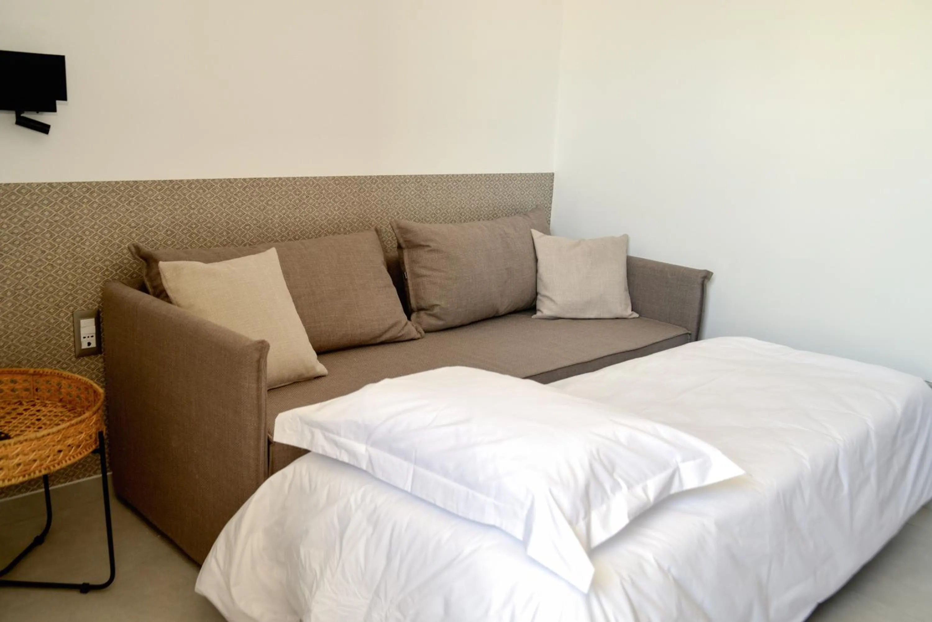 Seating area, Bed in KOUROS STONE SUITES