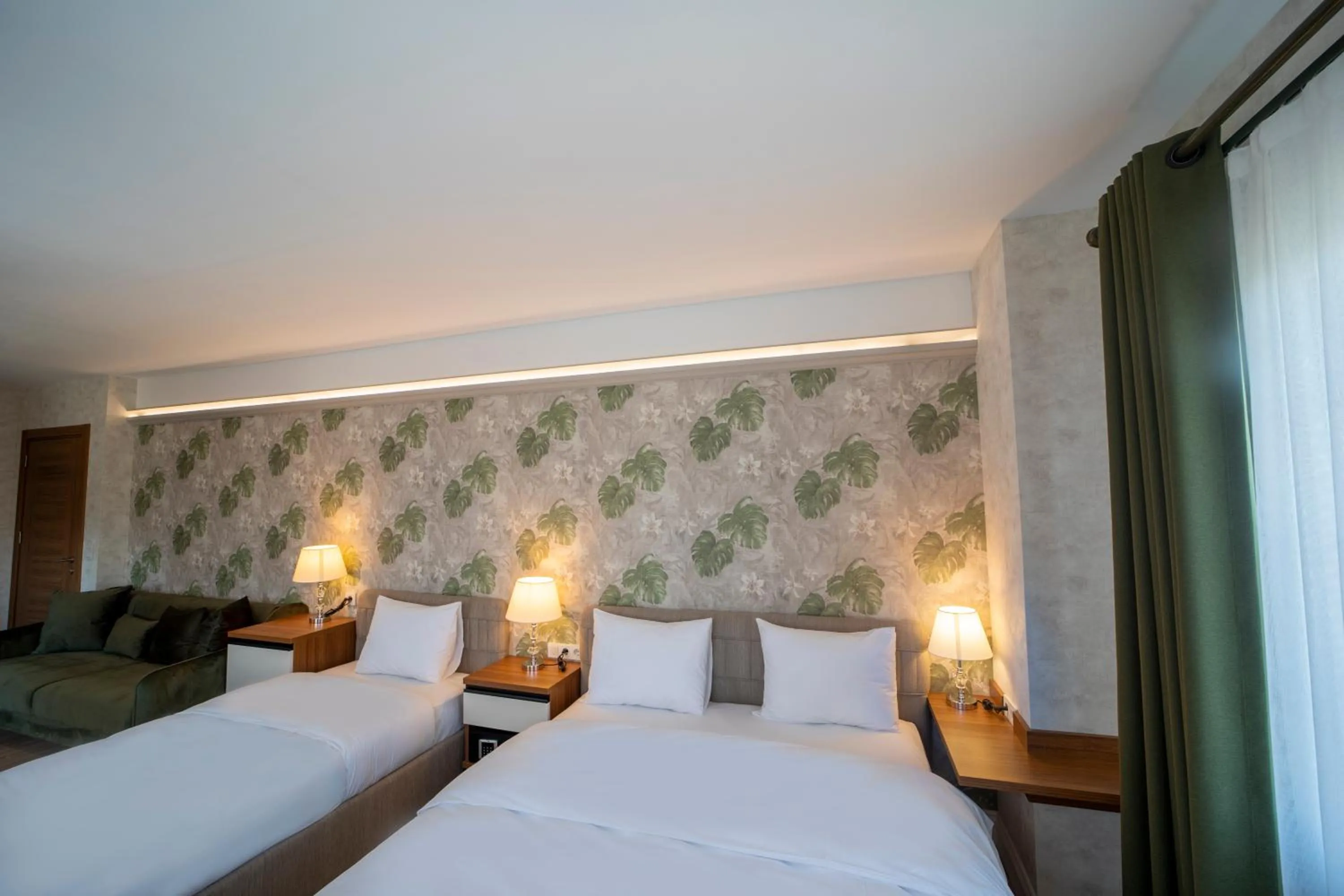 Bed in MELL City Suites Hotel