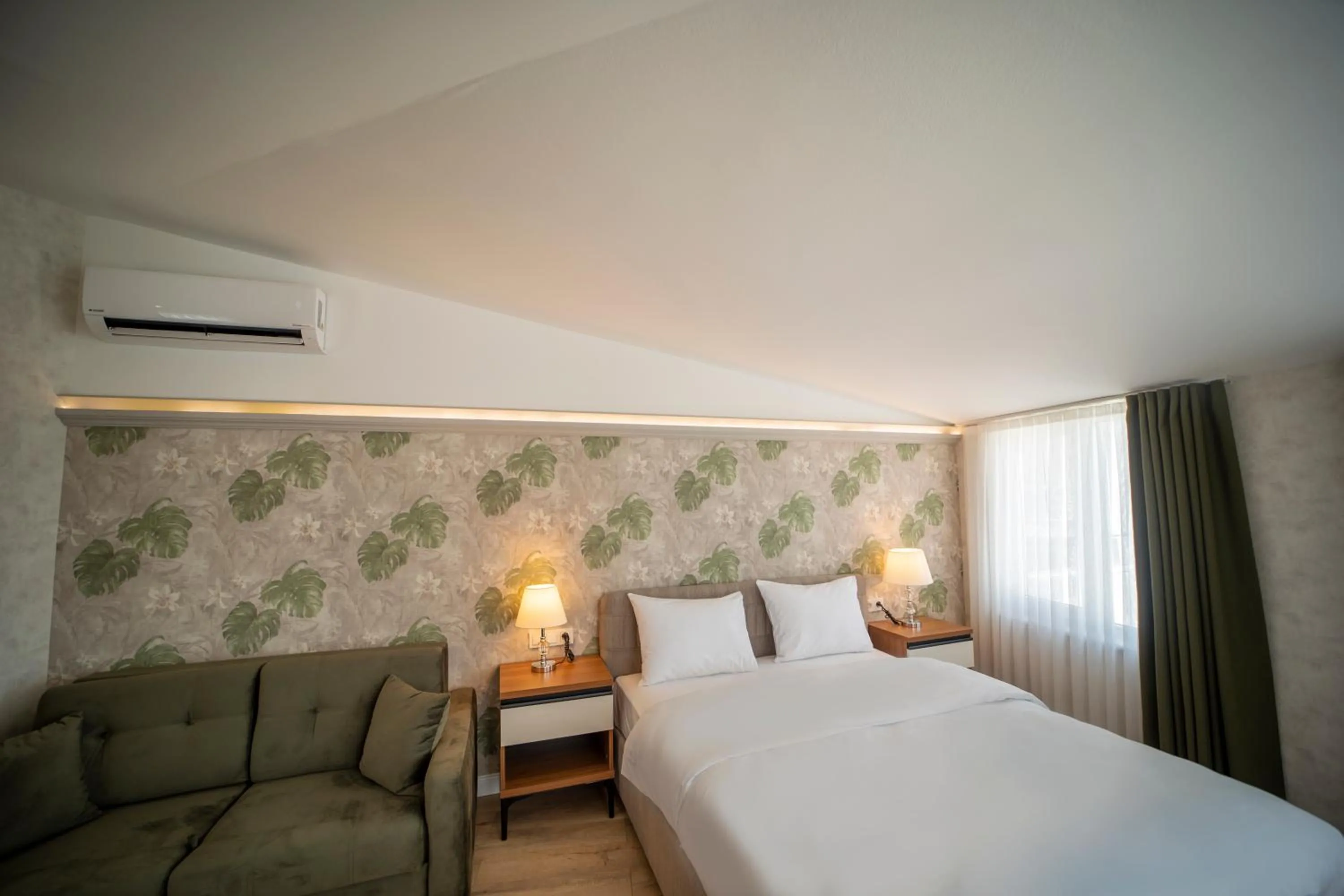 Bed in MELL City Suites Hotel