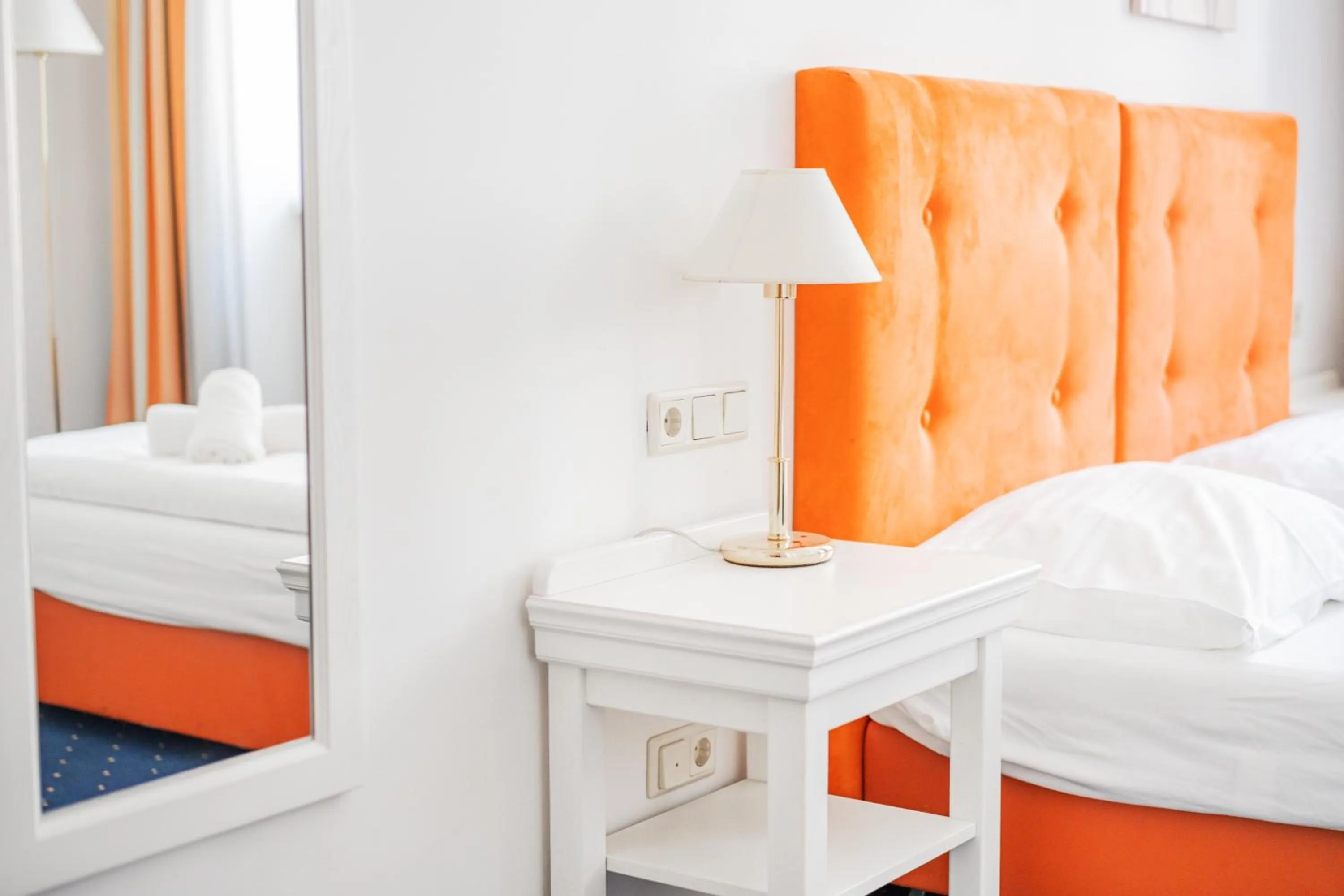 Bed in Self-Check-In Hotel Adlon