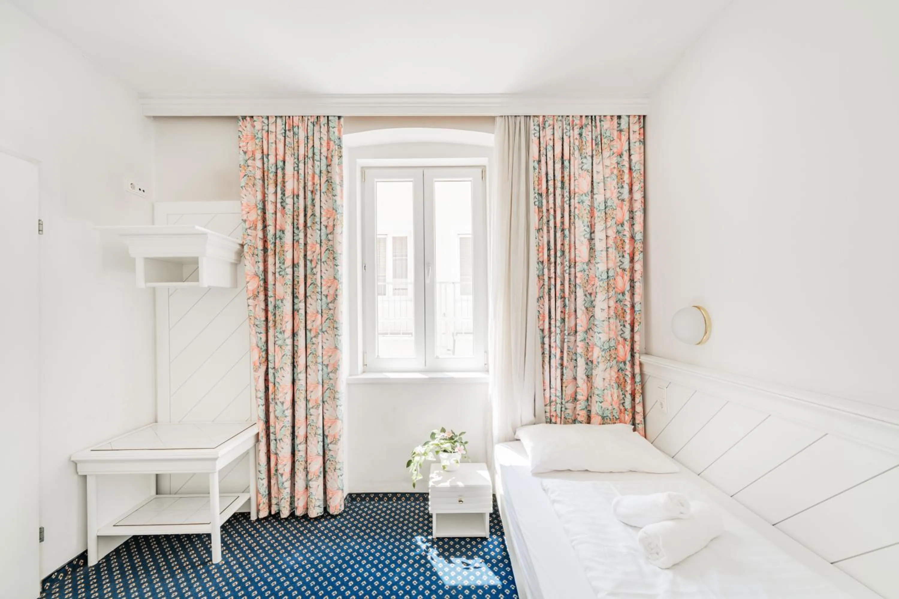 Bed in Self-Check-In Hotel Adlon