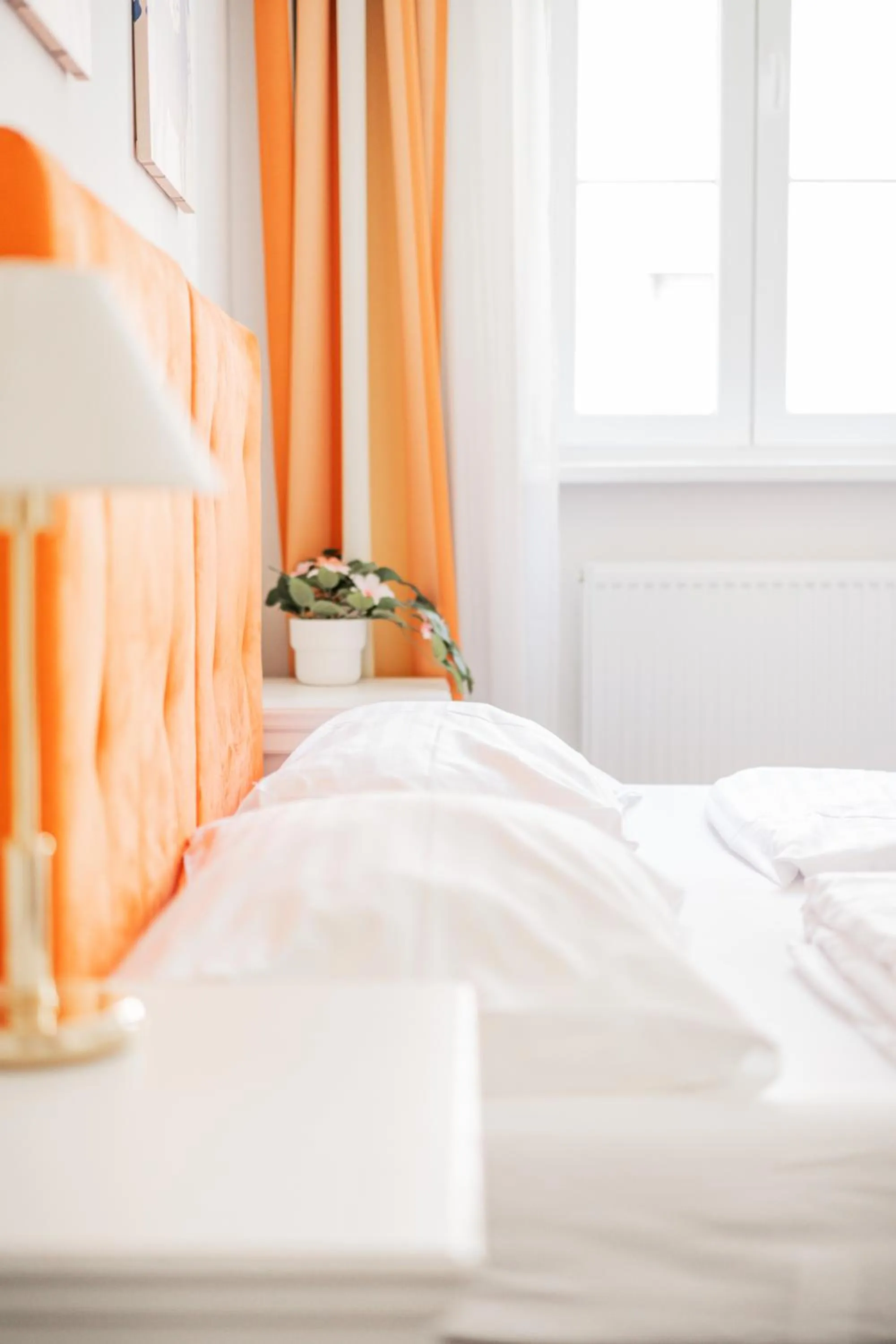 Bed in Self-Check-In Hotel Adlon