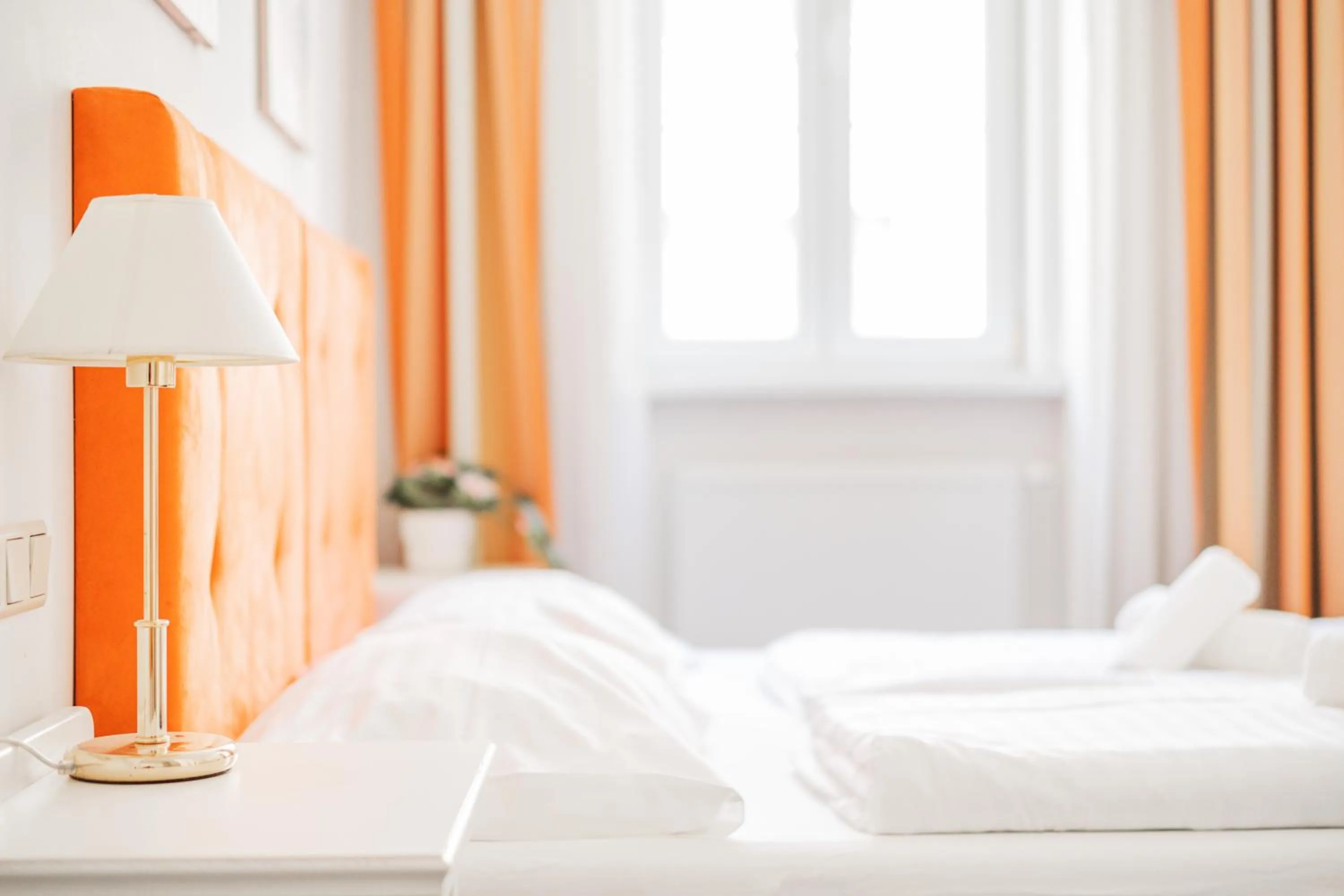 Bed in Self-Check-In Hotel Adlon