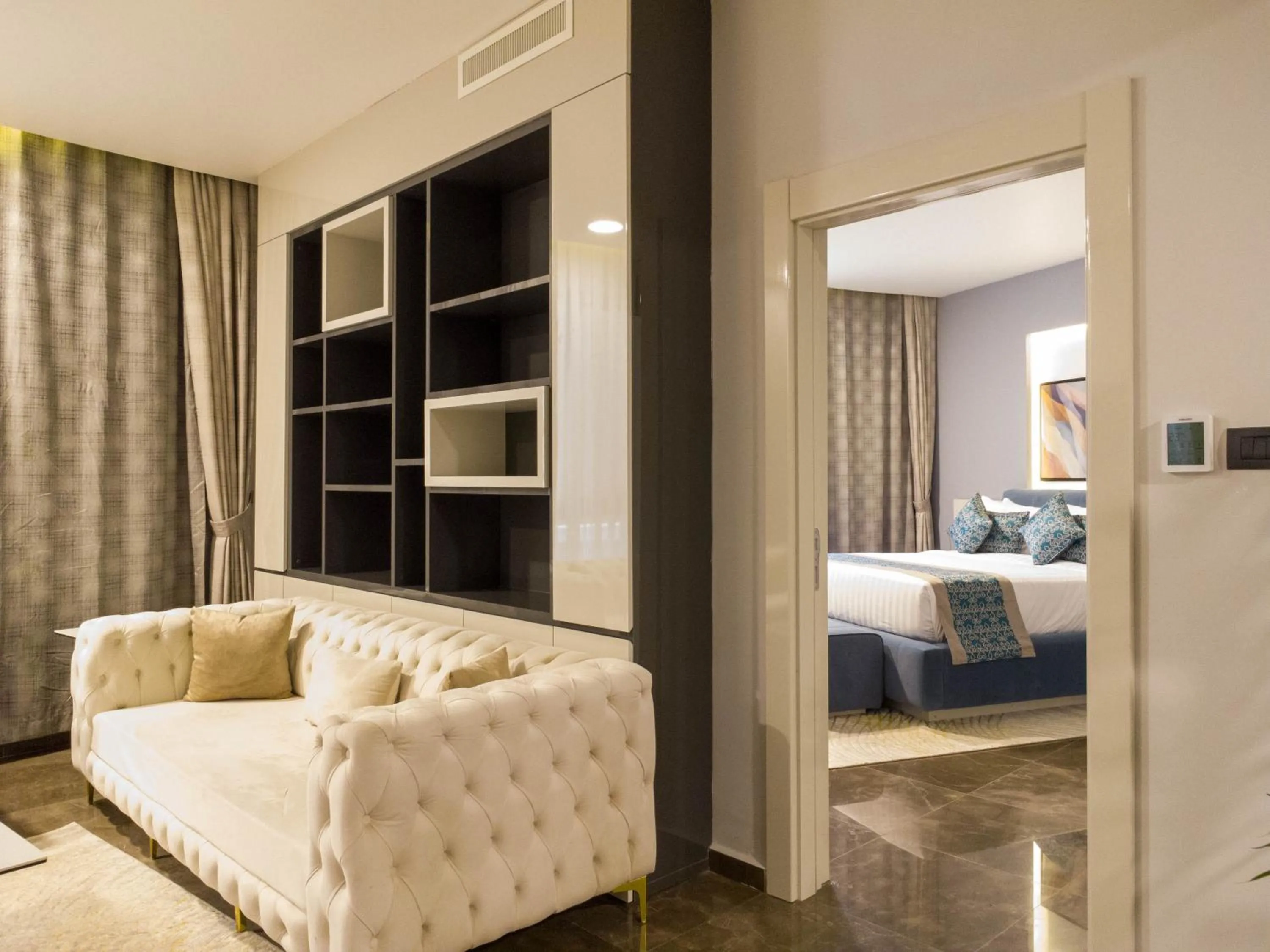 Living room, Bed in FASQ Hotel