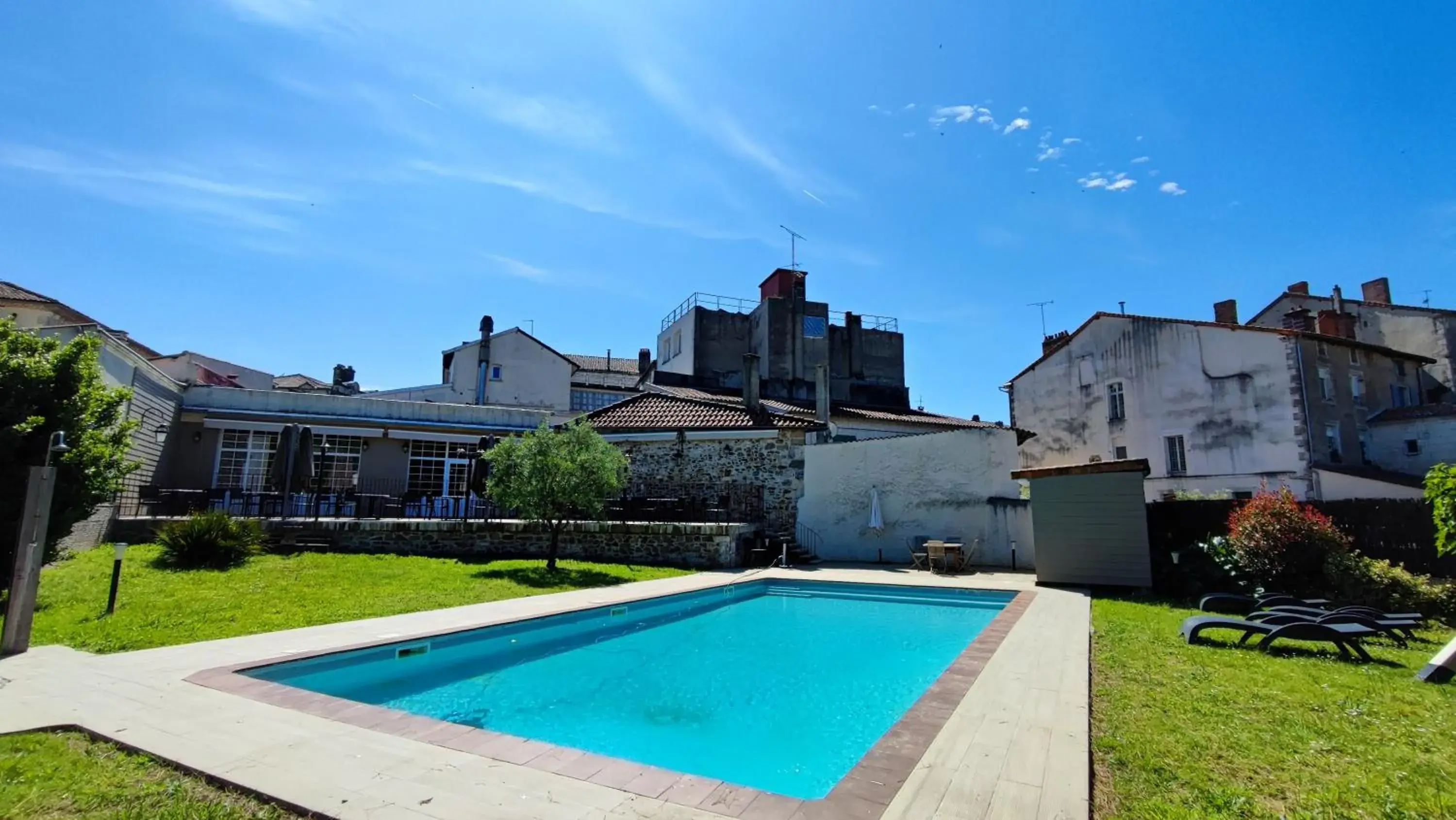 Garden view in Logis Grand Hotel Pelisson Garden view in Logis Grand Hotel Pelisson