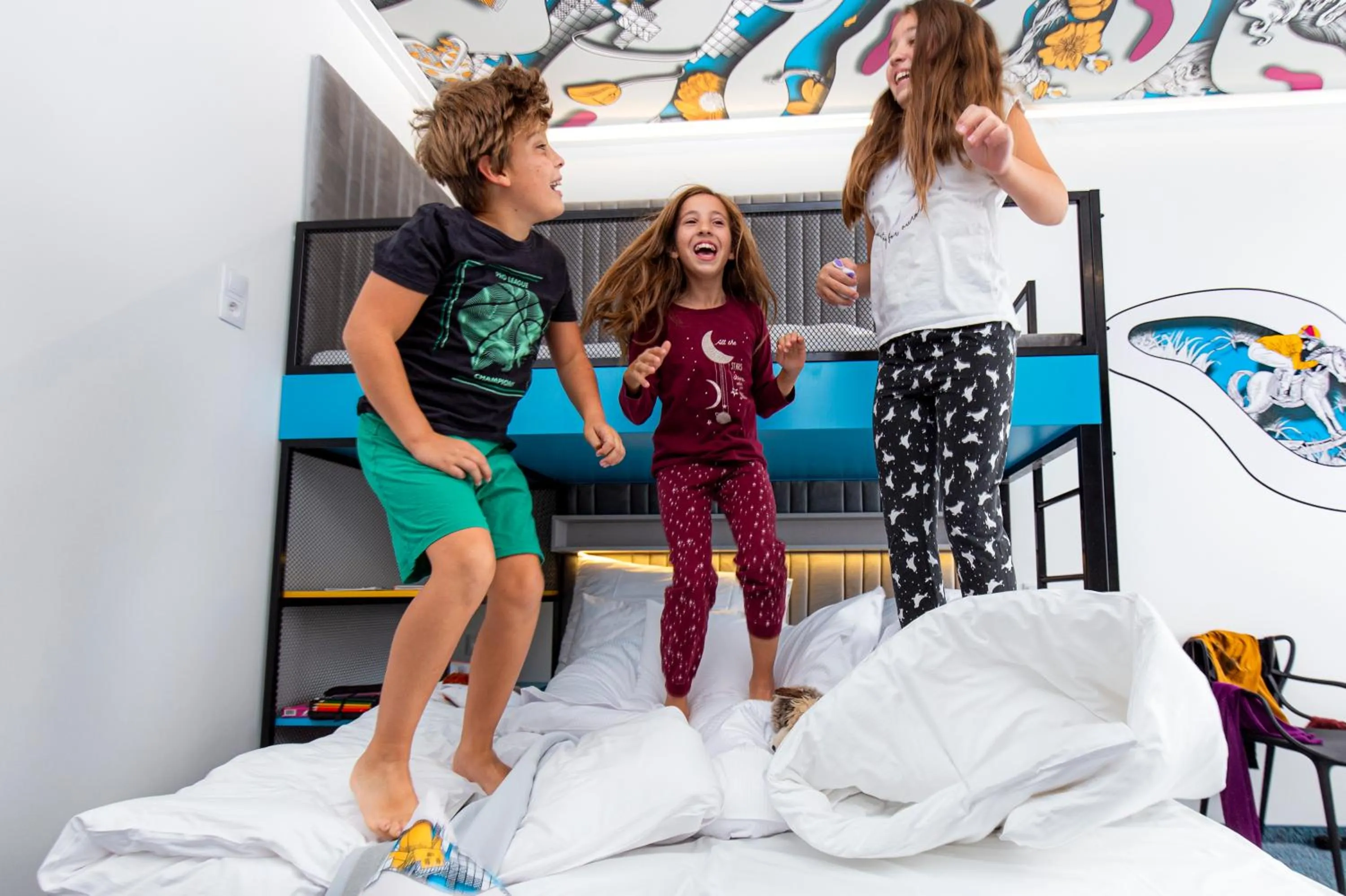 Bed in Family Apartments by ASTORIA Hotel & Medical Spa