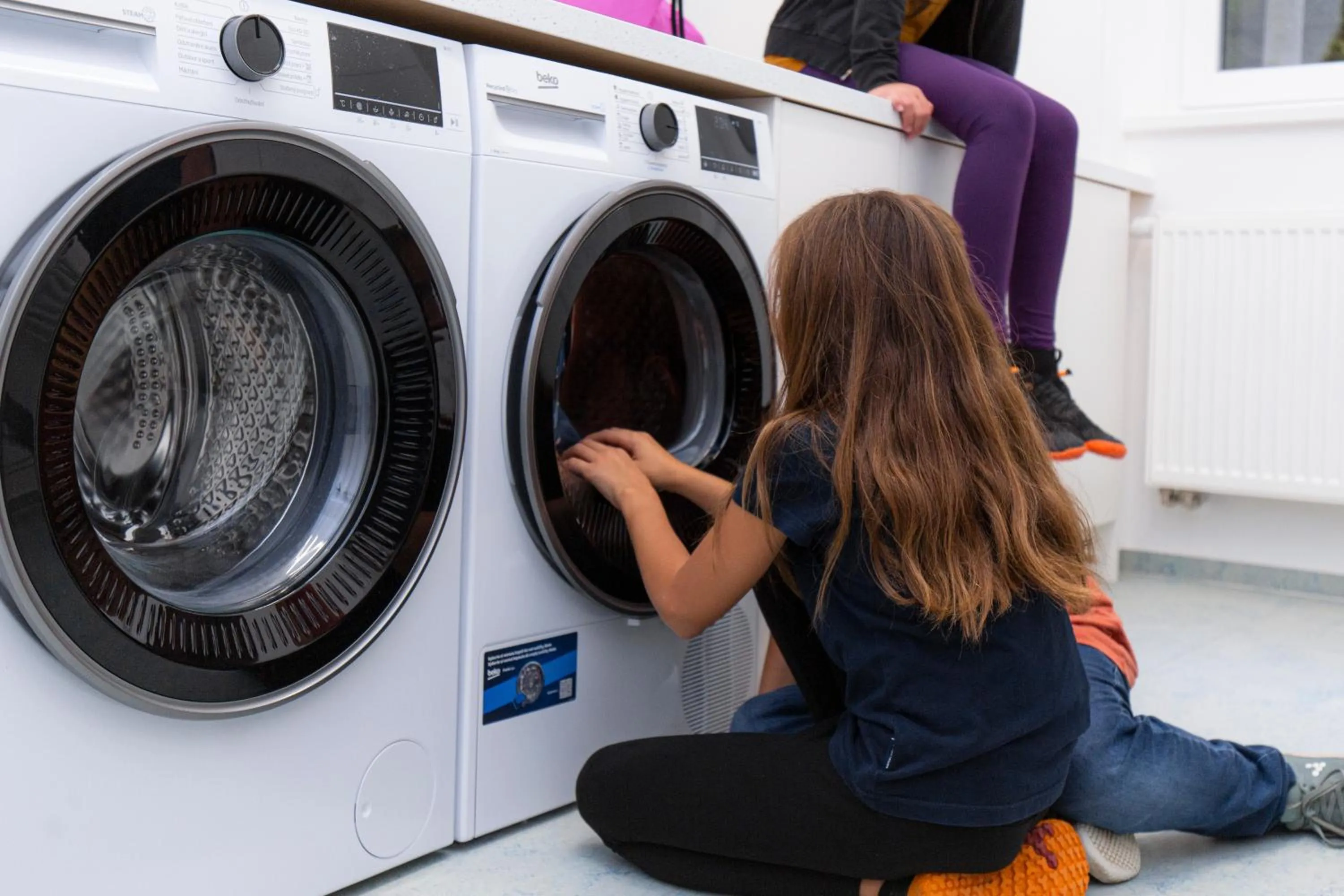 washing machine in Family Apartments by ASTORIA Hotel & Medical Spa