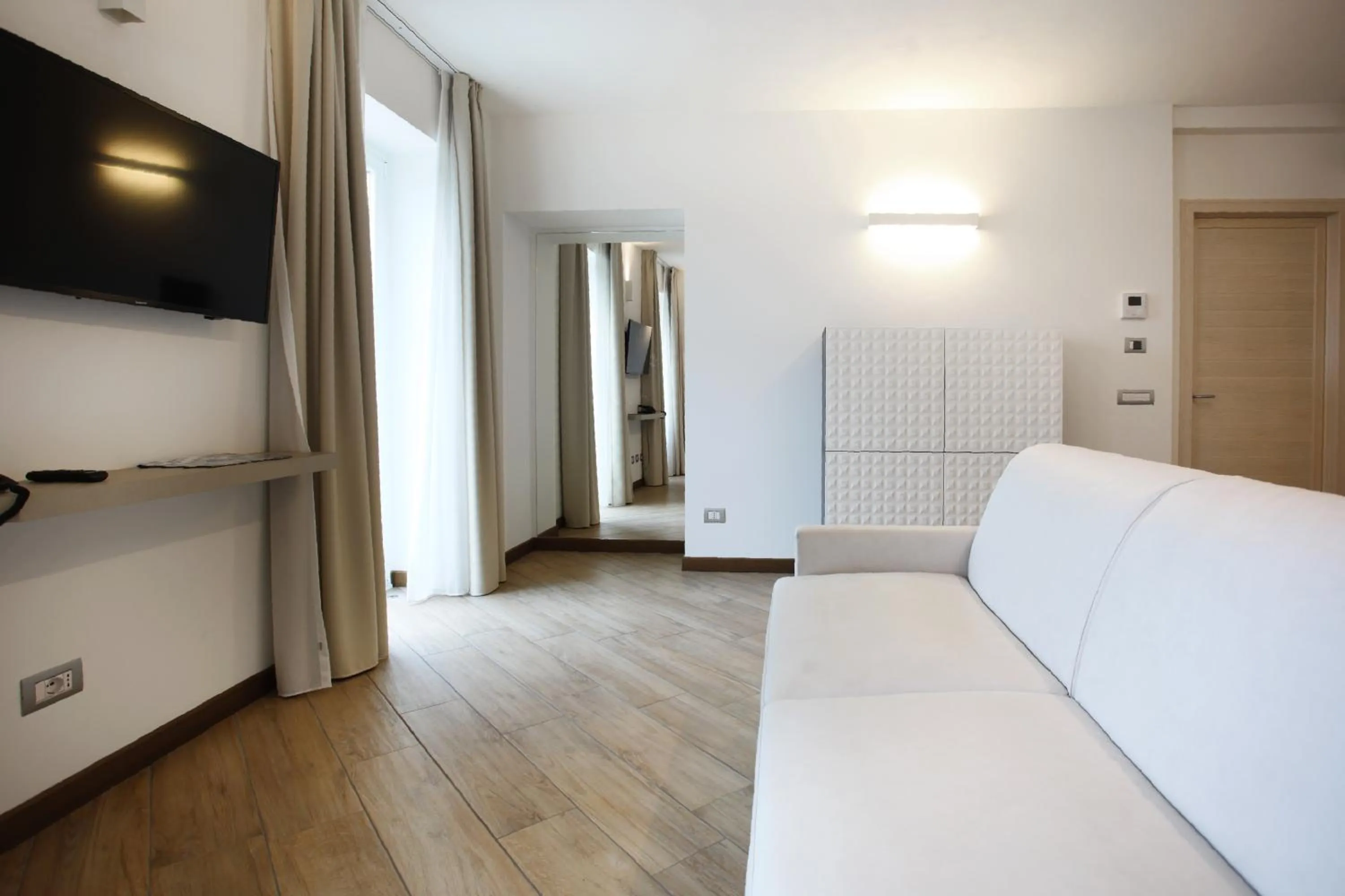 Living room, Bed in Hotel Ponti