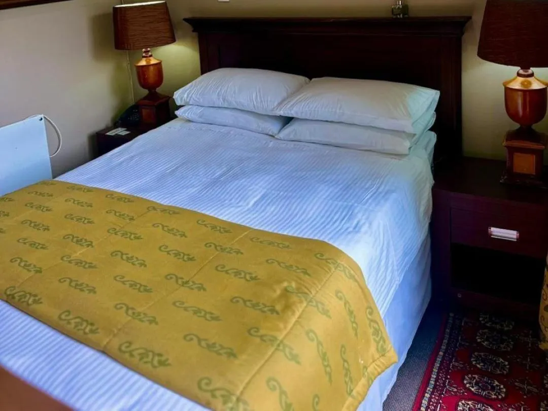 Bed in Aanmani Rose Guesthouse