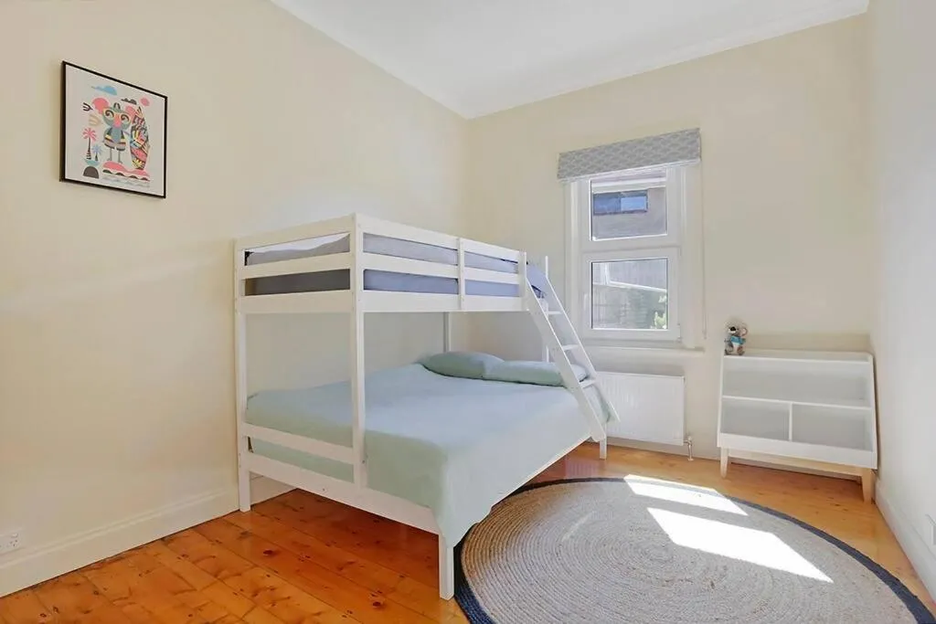 Bed in White Sand Cottage
