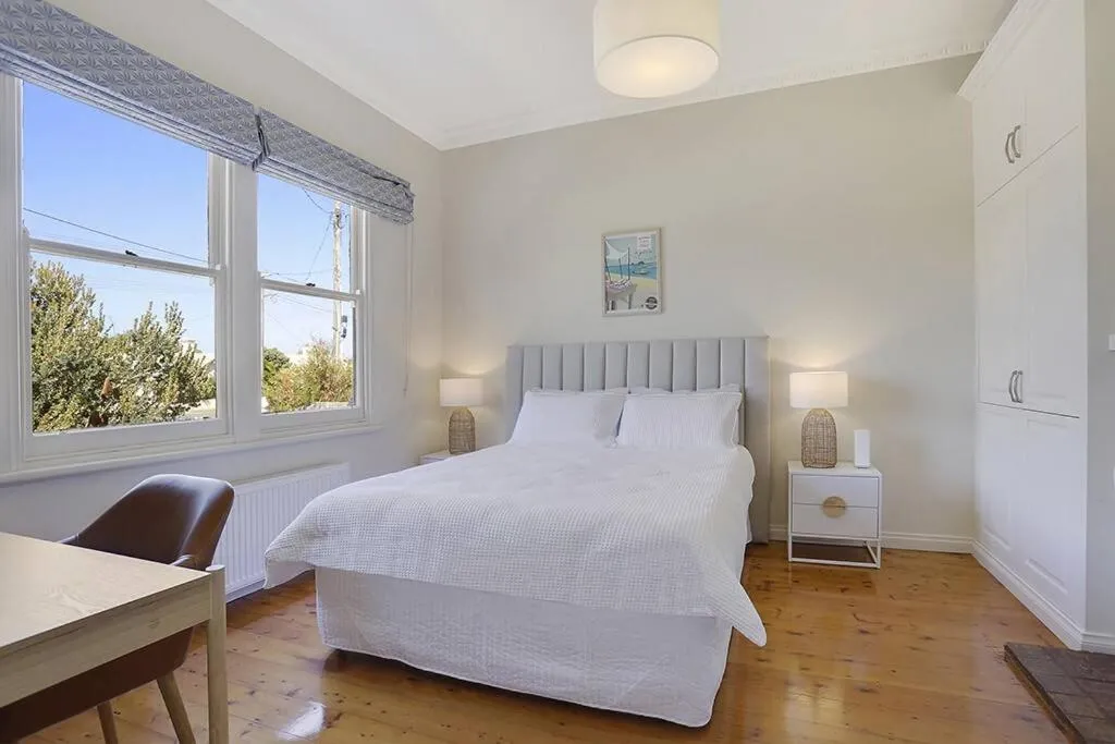Bed in White Sand Cottage