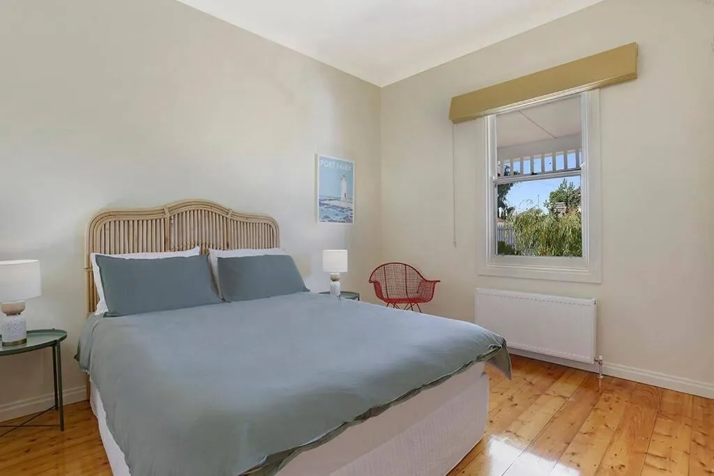 Bed in White Sand Cottage
