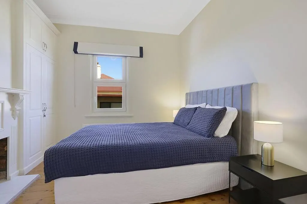 Bed in White Sand Cottage