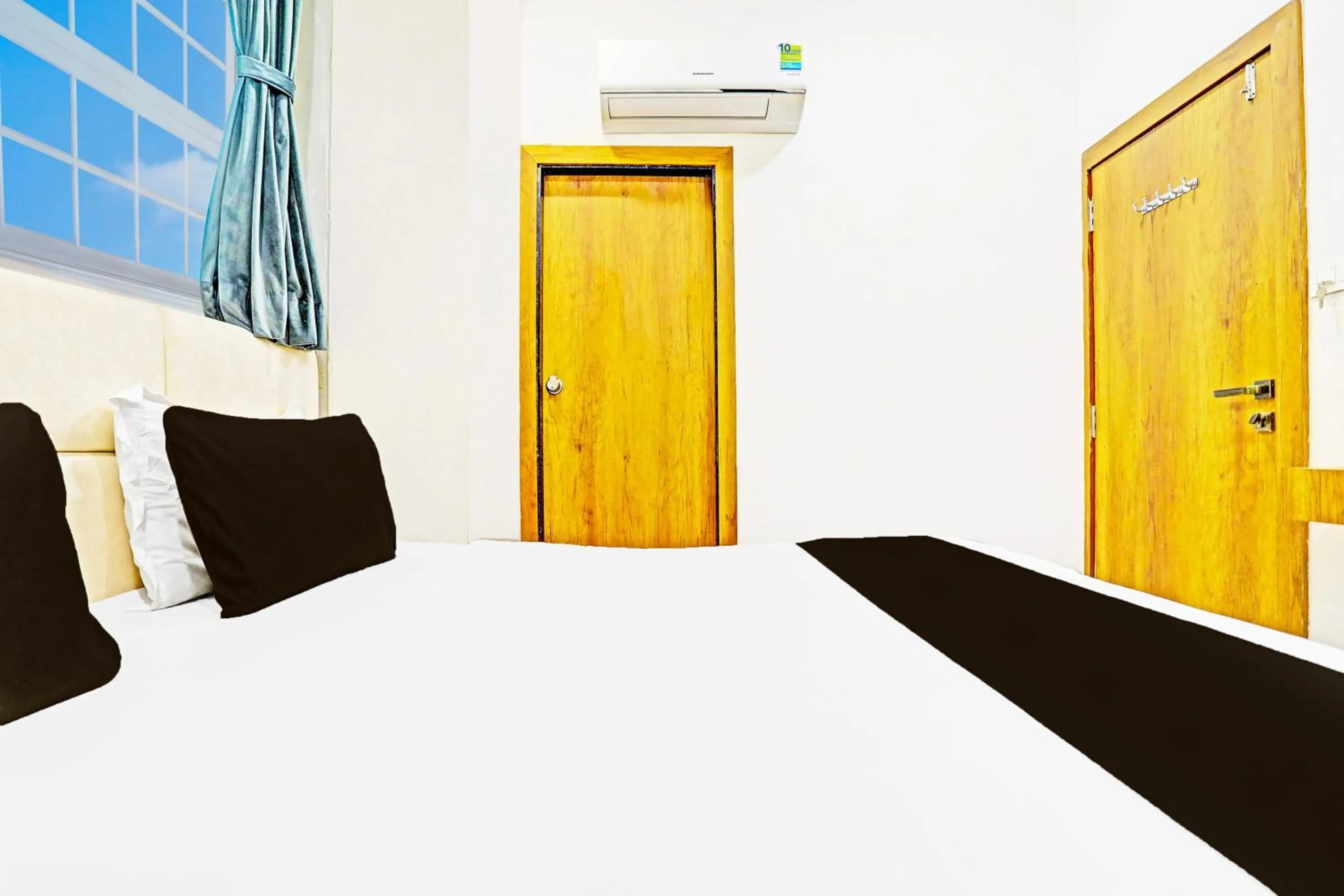 Bedroom in Collection O Adajan Formerly Hotel Western Inn