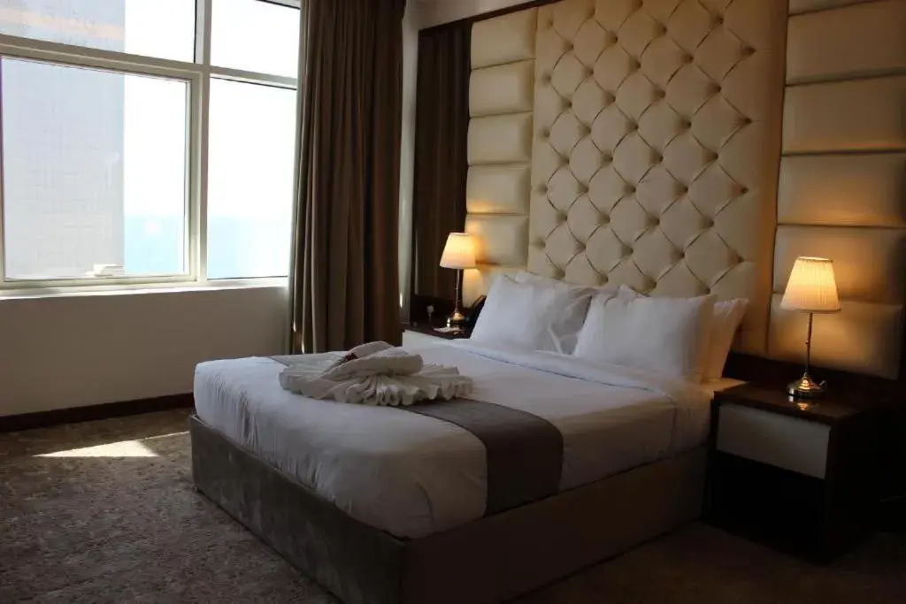 Bed in Dolphin Continental Hotel Bed in Dolphin Continental Hotel