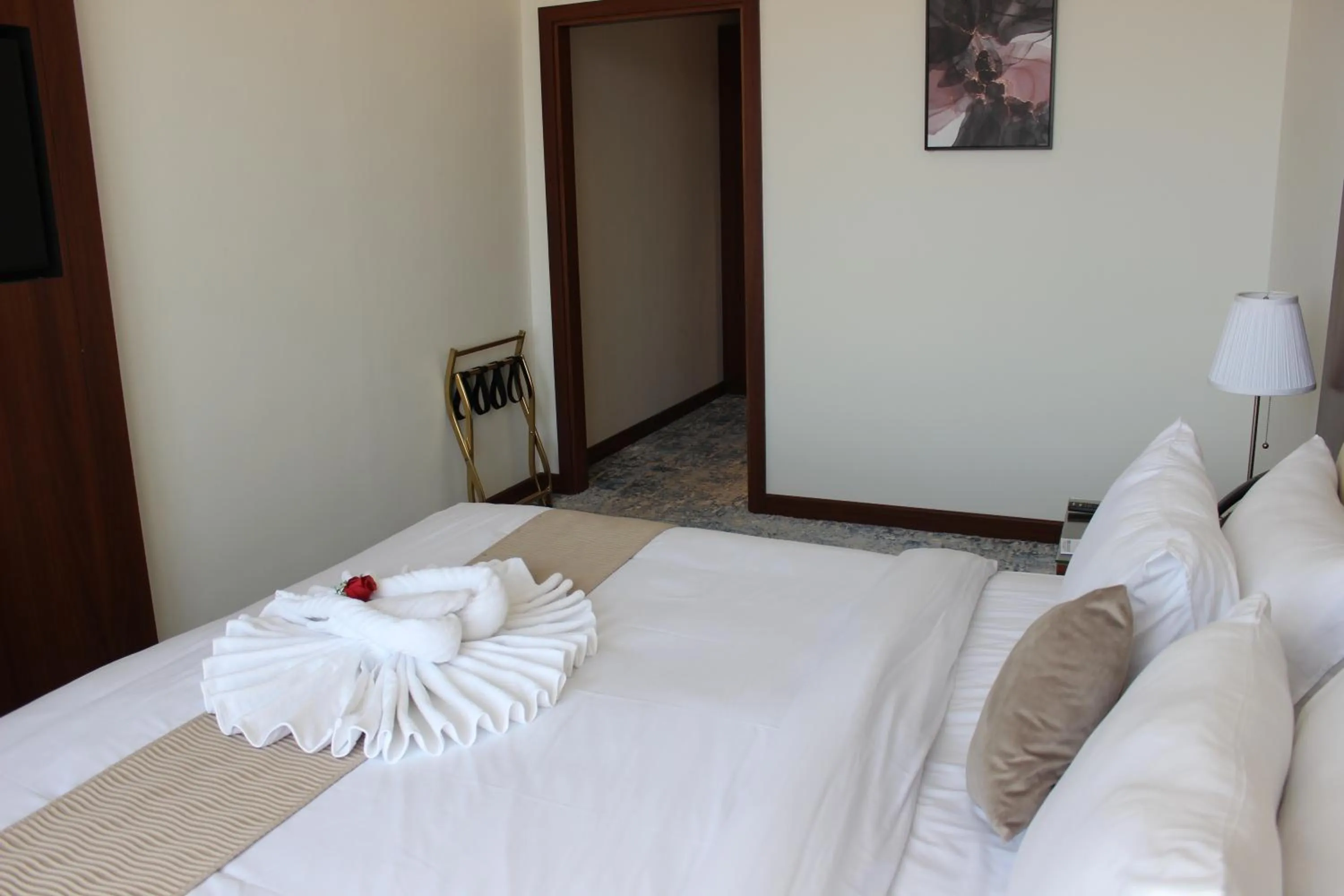 Bed in Dolphin Continental Hotel