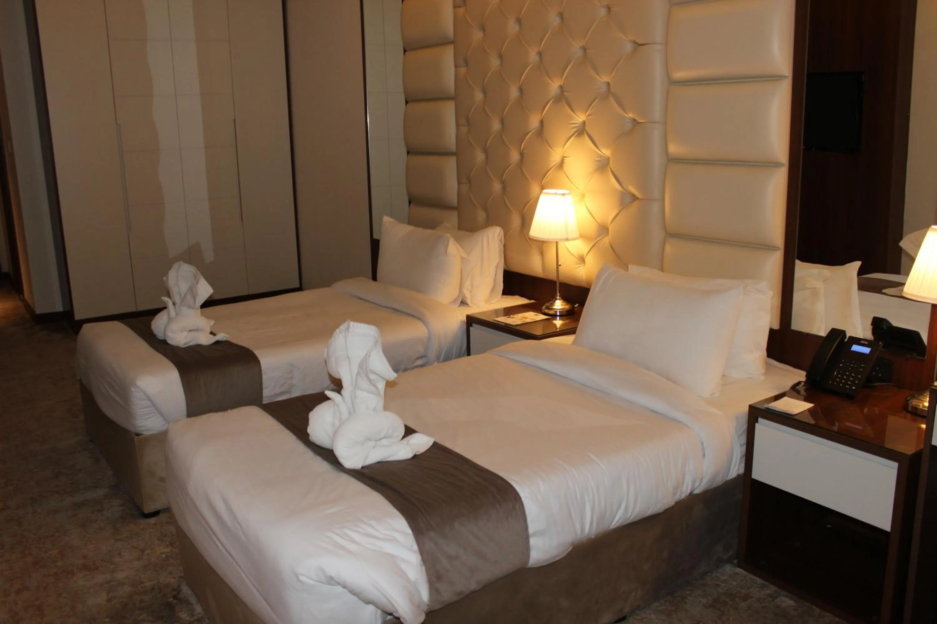 Bed in Dolphin Continental Hotel