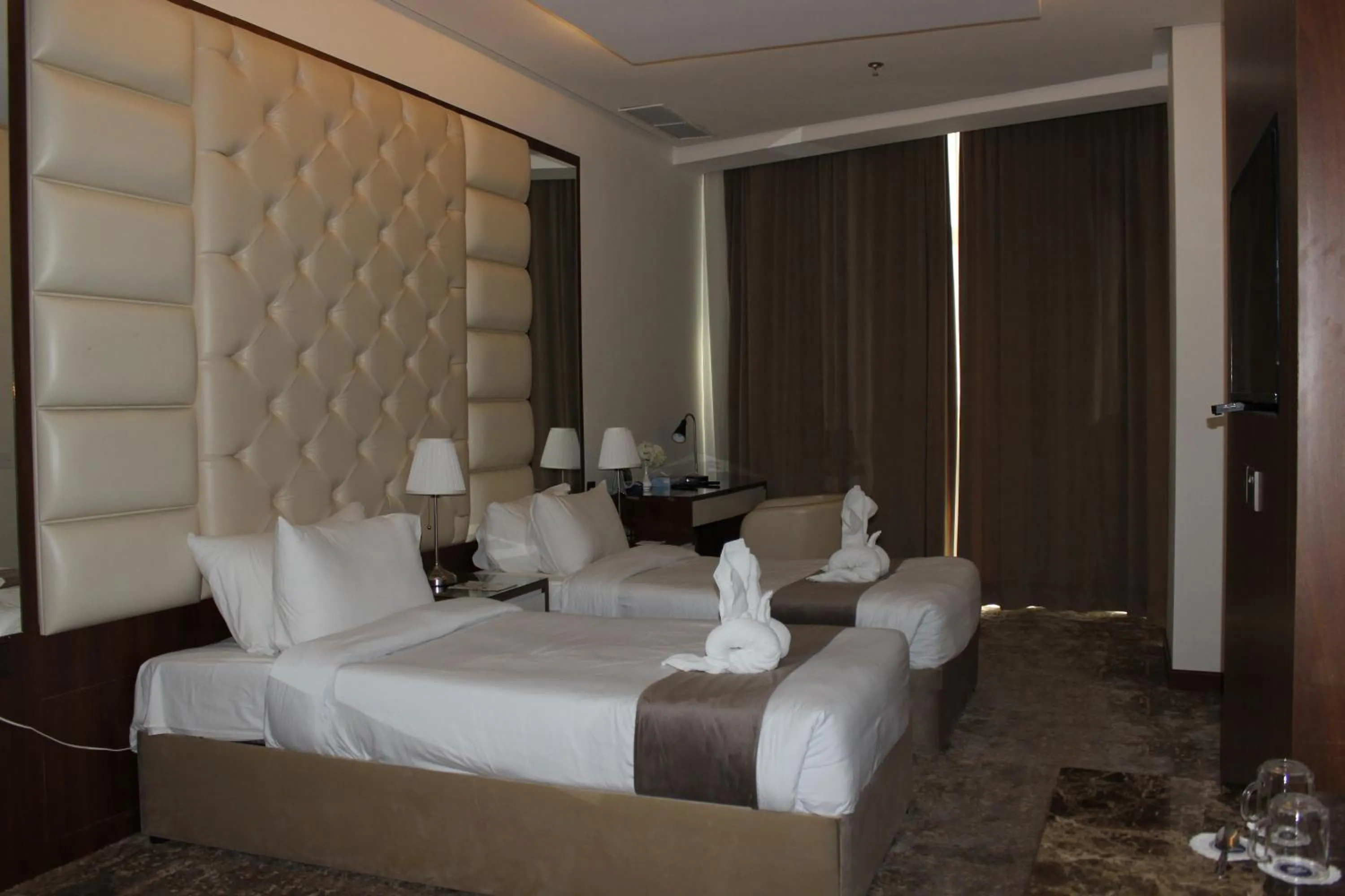 Bed in Dolphin Continental Hotel