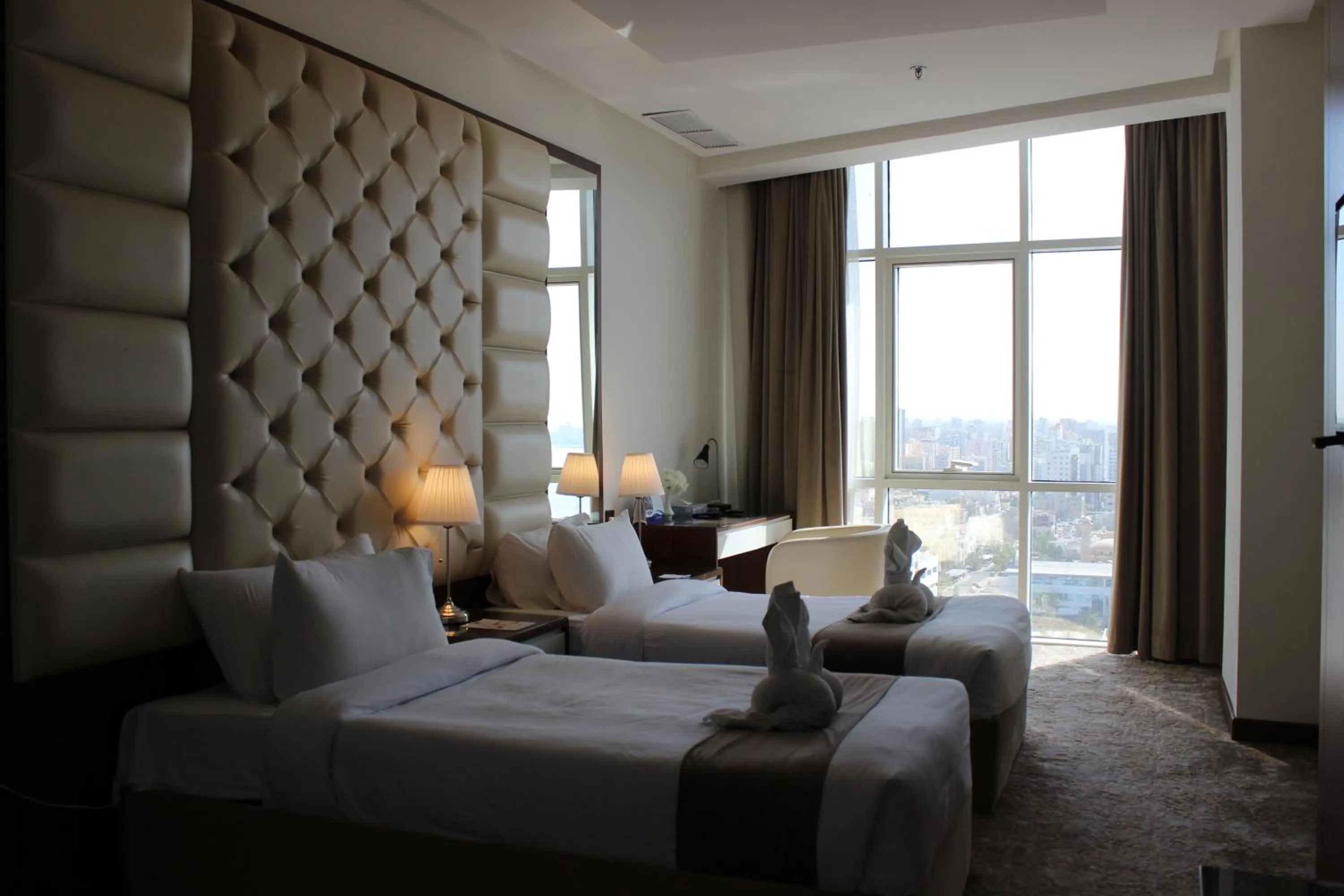 Bed in Dolphin Continental Hotel