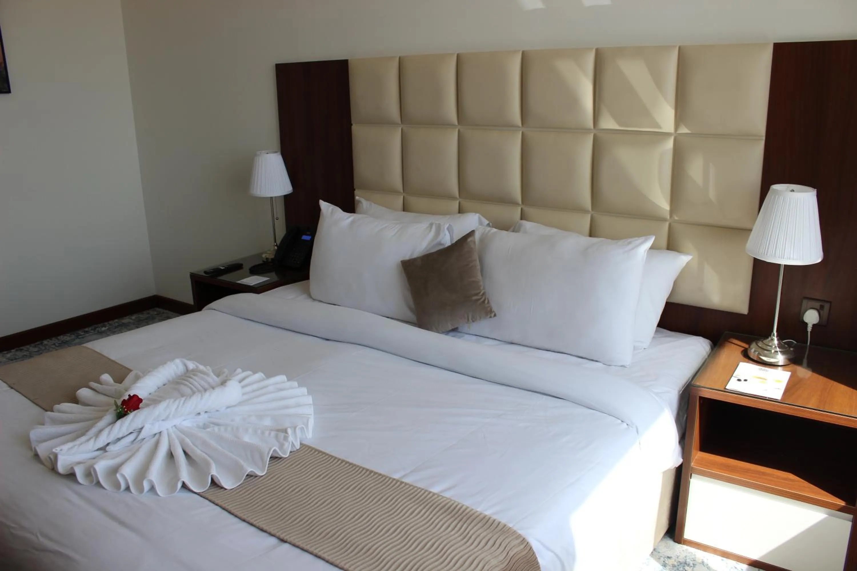 Bed in Dolphin Continental Hotel