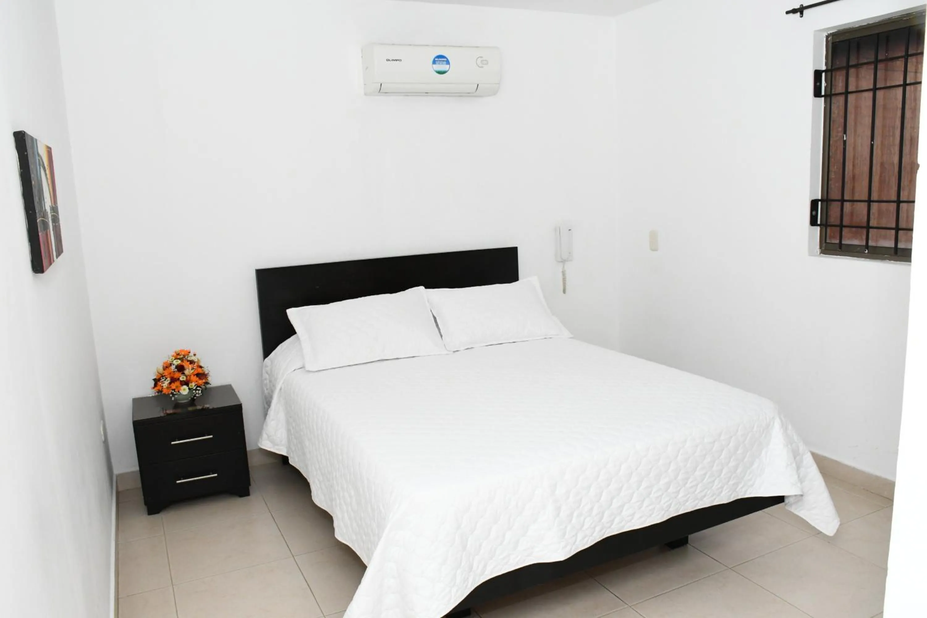 Bed in Apartahotel Los Cerezos