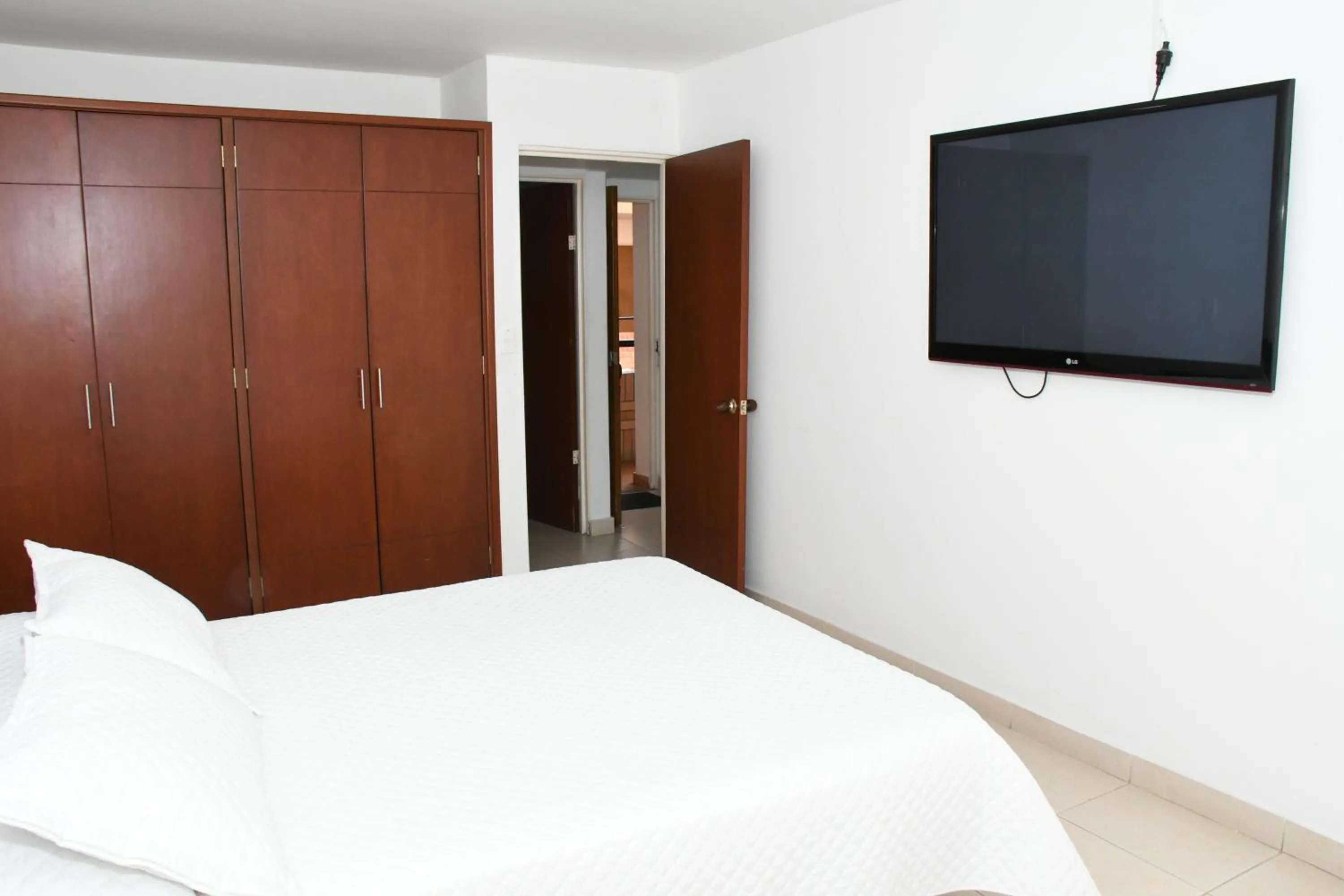 Bed in Apartahotel Los Cerezos