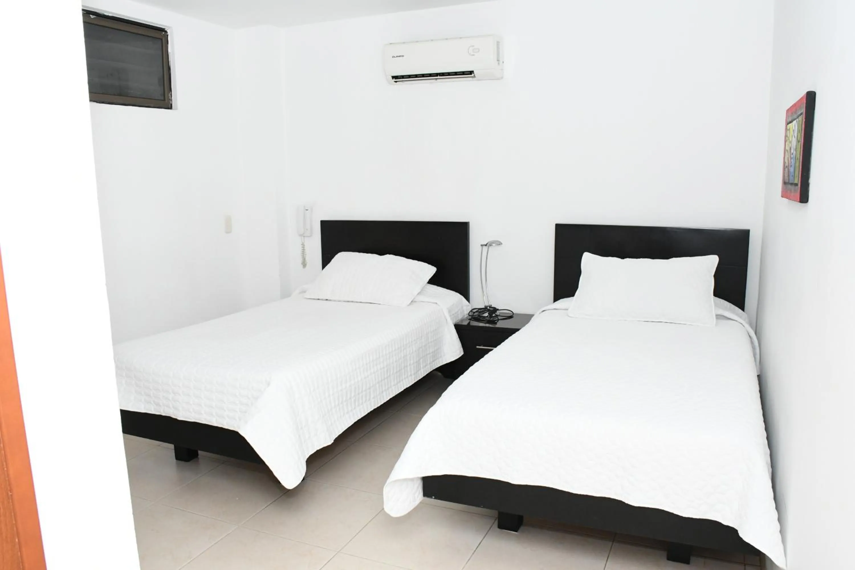 Bed in Apartahotel Los Cerezos