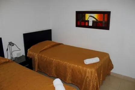 Bed in Apartahotel Los Cerezos