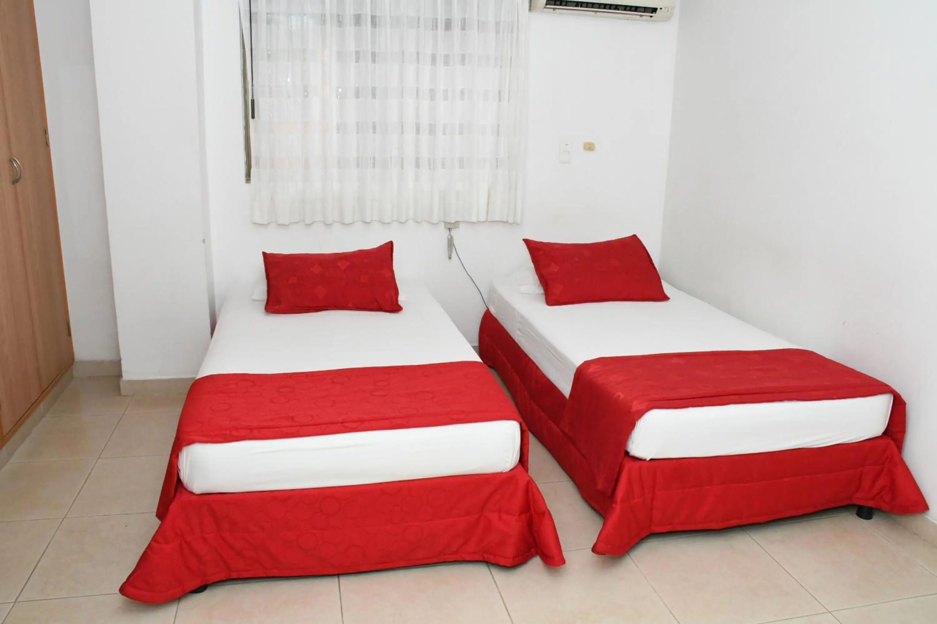 Bed in Apartahotel Los Cerezos