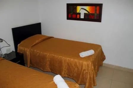Bed in Apartahotel Los Cerezos