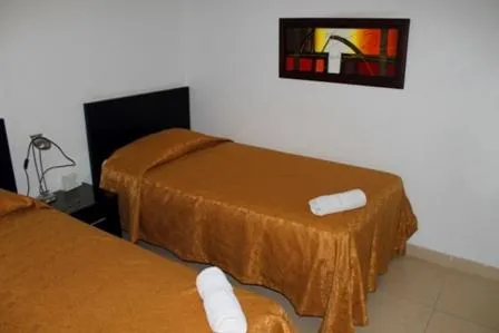 Bed in Apartahotel Los Cerezos