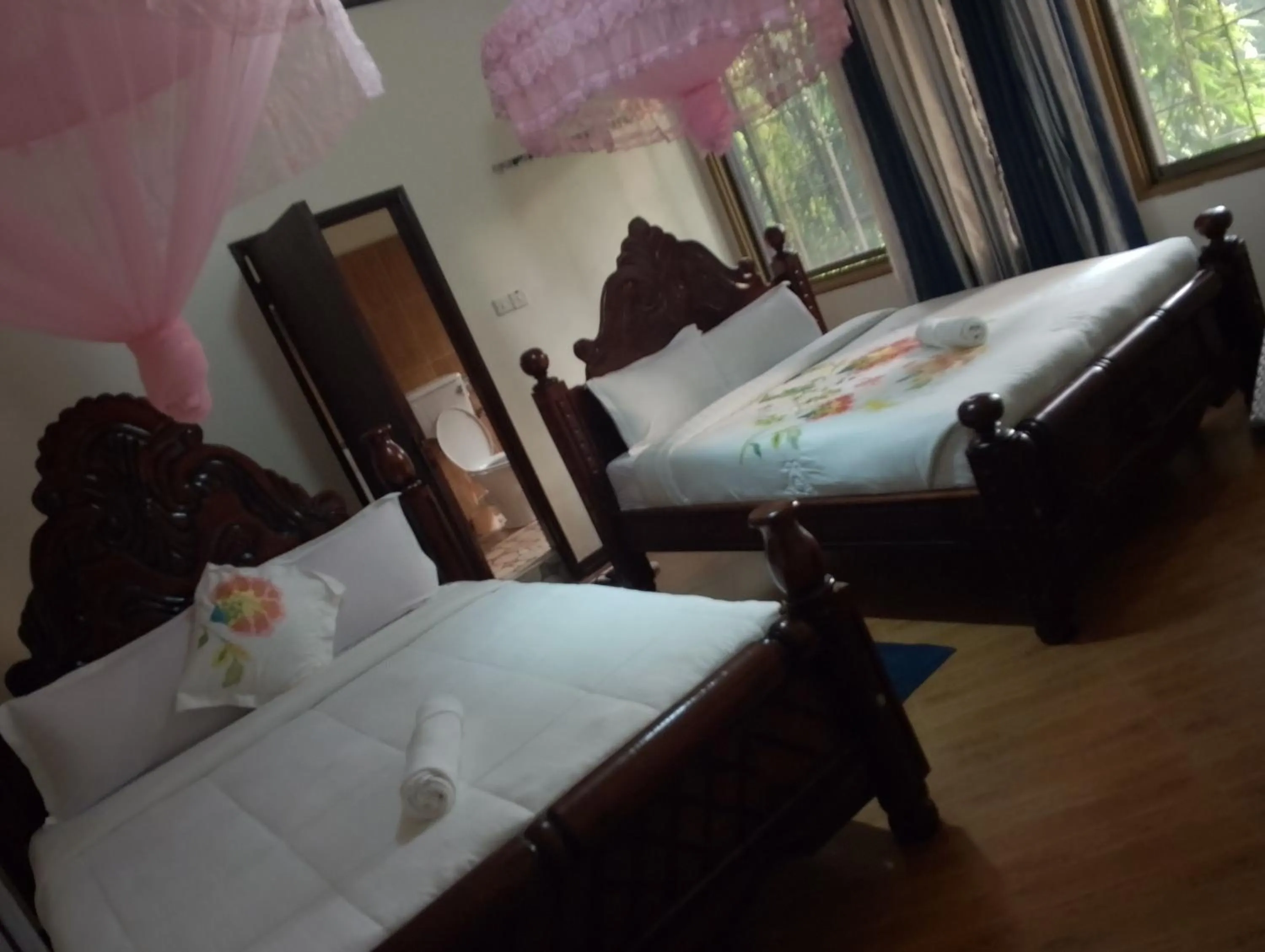 Bed in DISCOVERY COURTS HOTEL