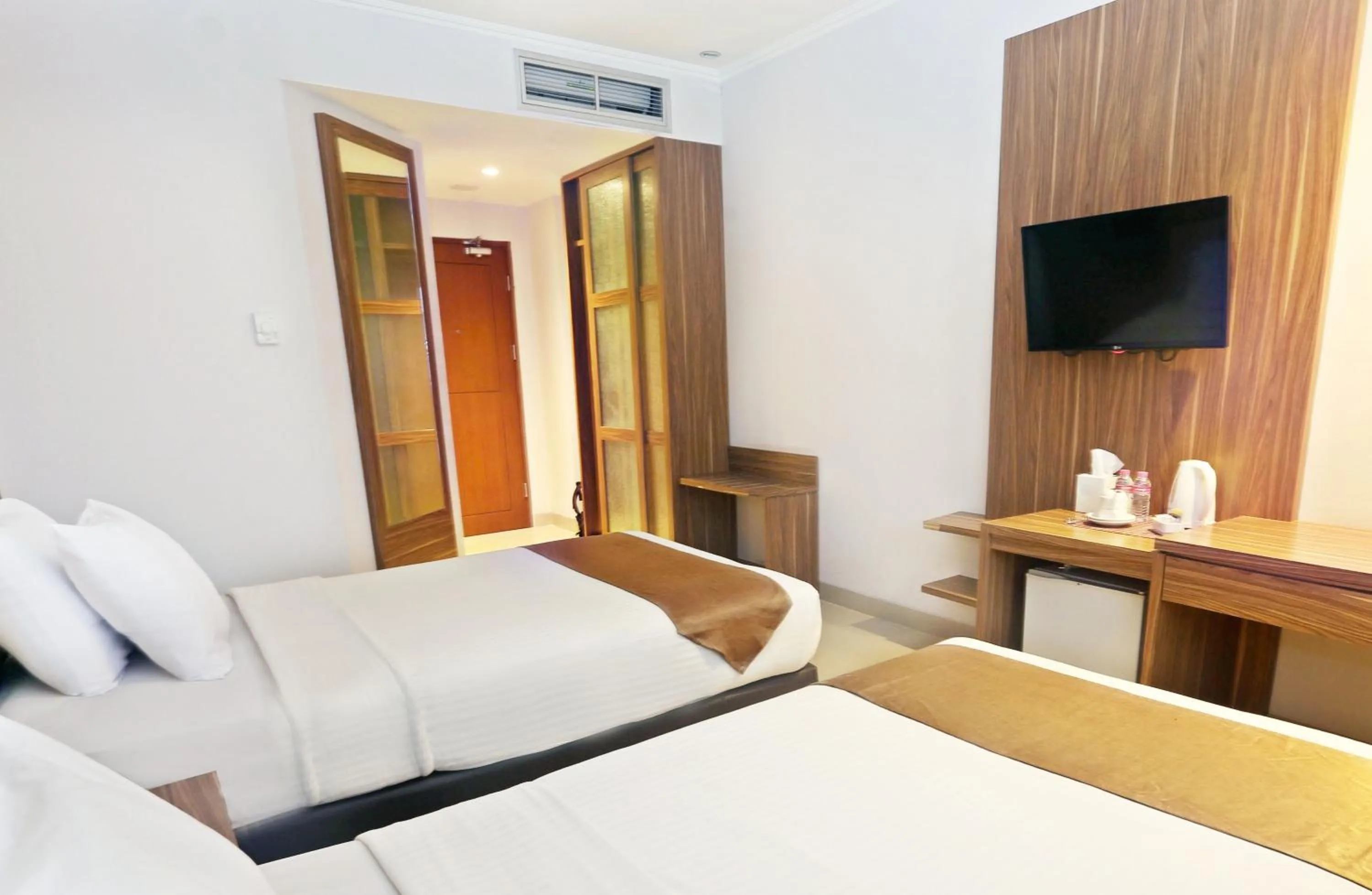 Bed in Lorin Dwangsa Solo Hotel