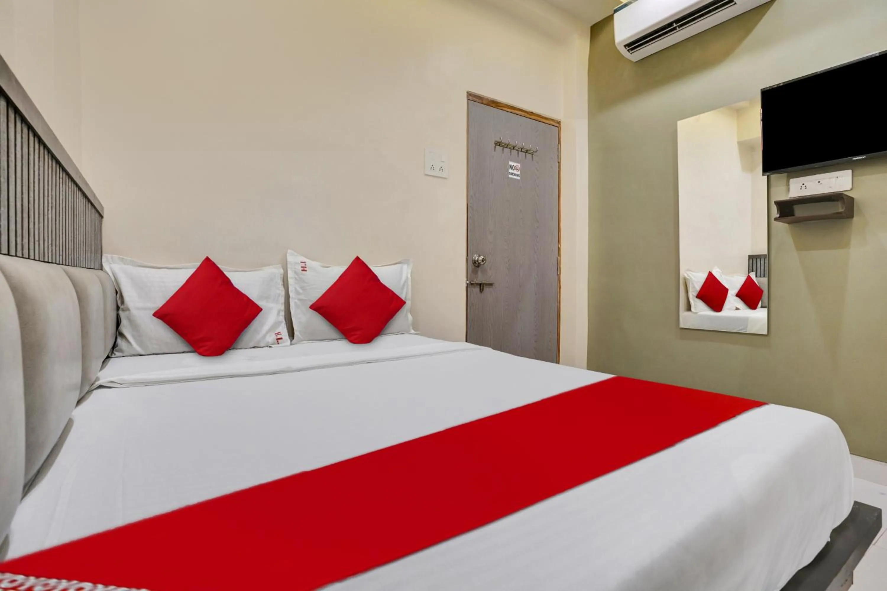 Bedroom in Hotel O Dhiman Residency